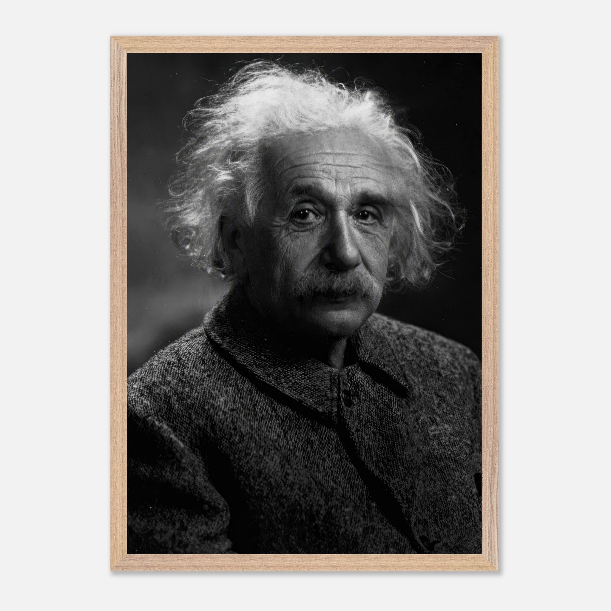 Vintage framed portrait of Albert Einstein, showcasing his iconic expression and style in black-and-white.