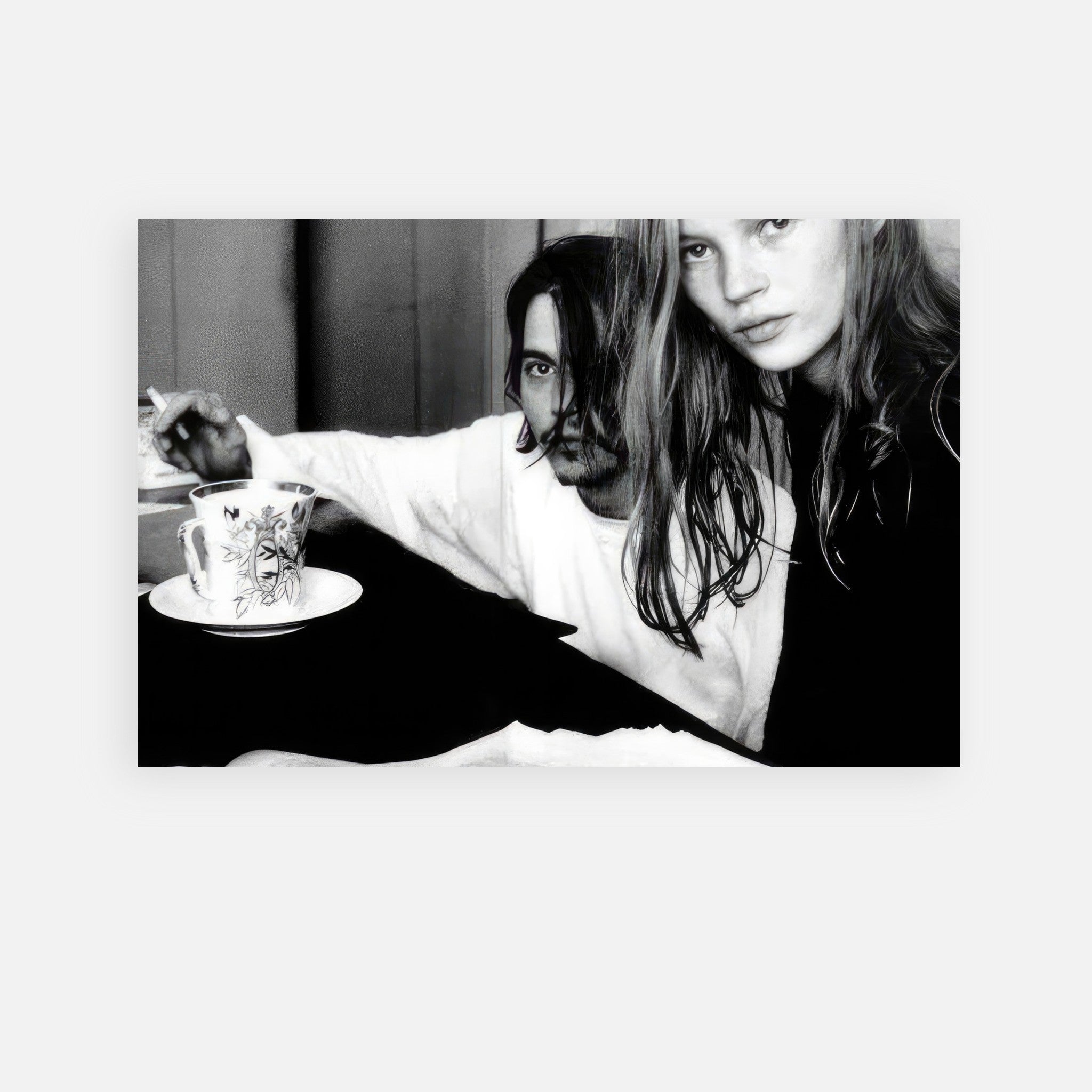 Johnny Depp and Kate Moss captured in a black-and-white metal print, embodying '90s romance and rebellion.