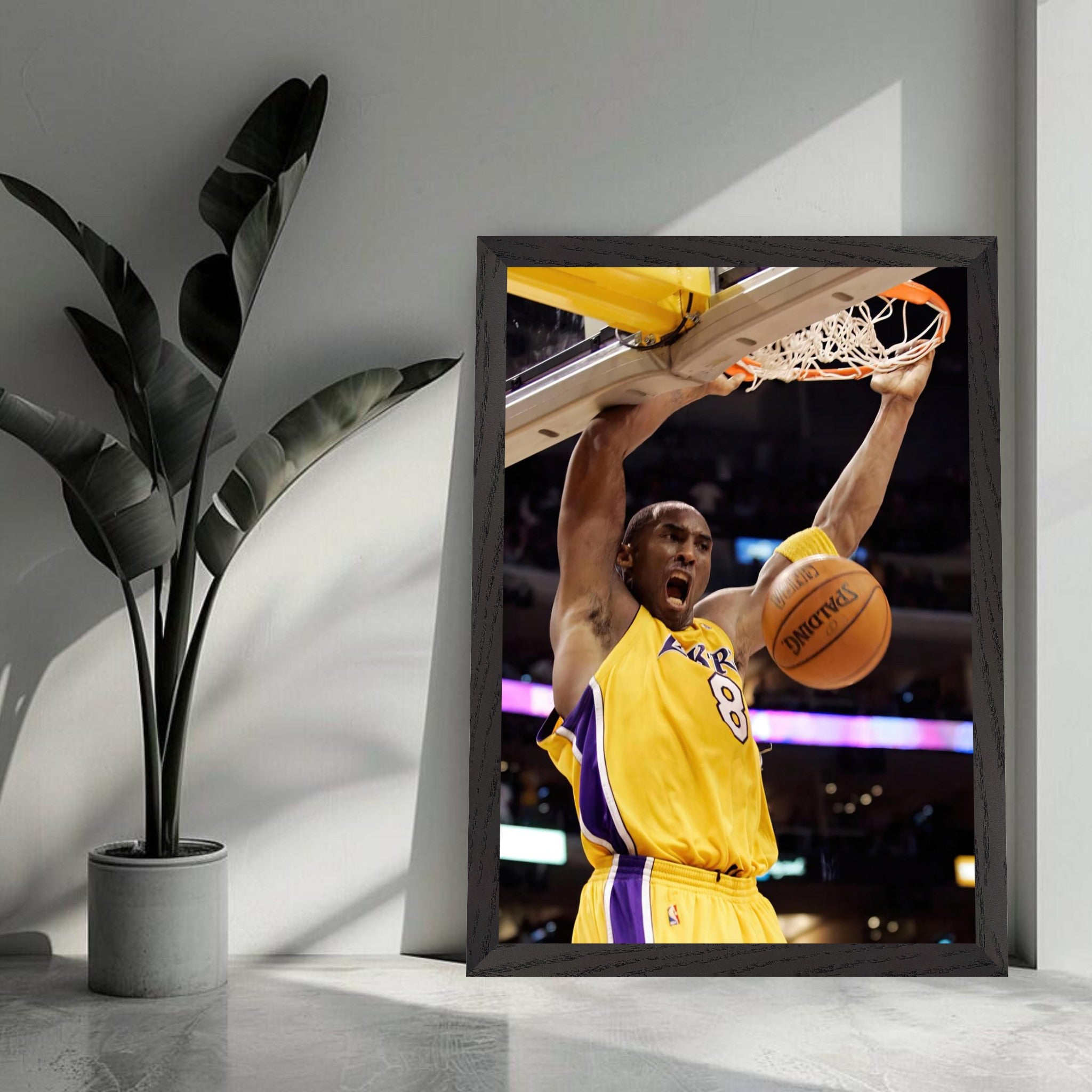 Kobe Bryant's vintage framed print capturing his iconic slam dunk with athleticism and passion for basketball.