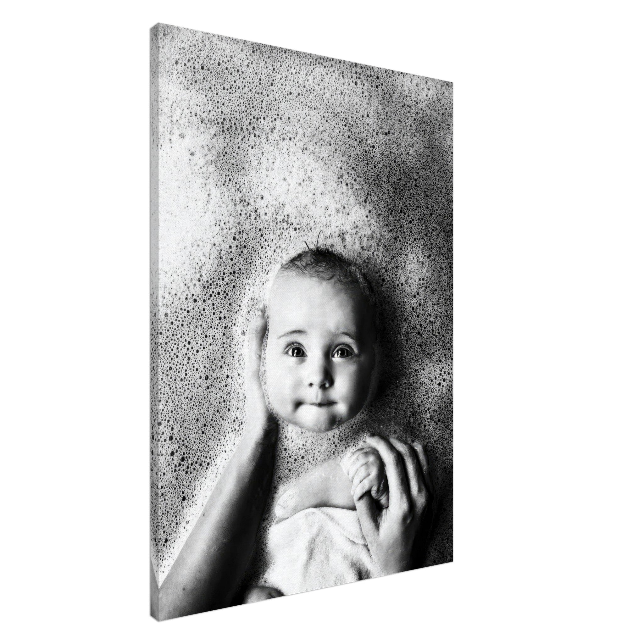 Black-and-white canvas print of a baby enjoying bath time, surrounded by bubbles and showcasing a joyful expression.