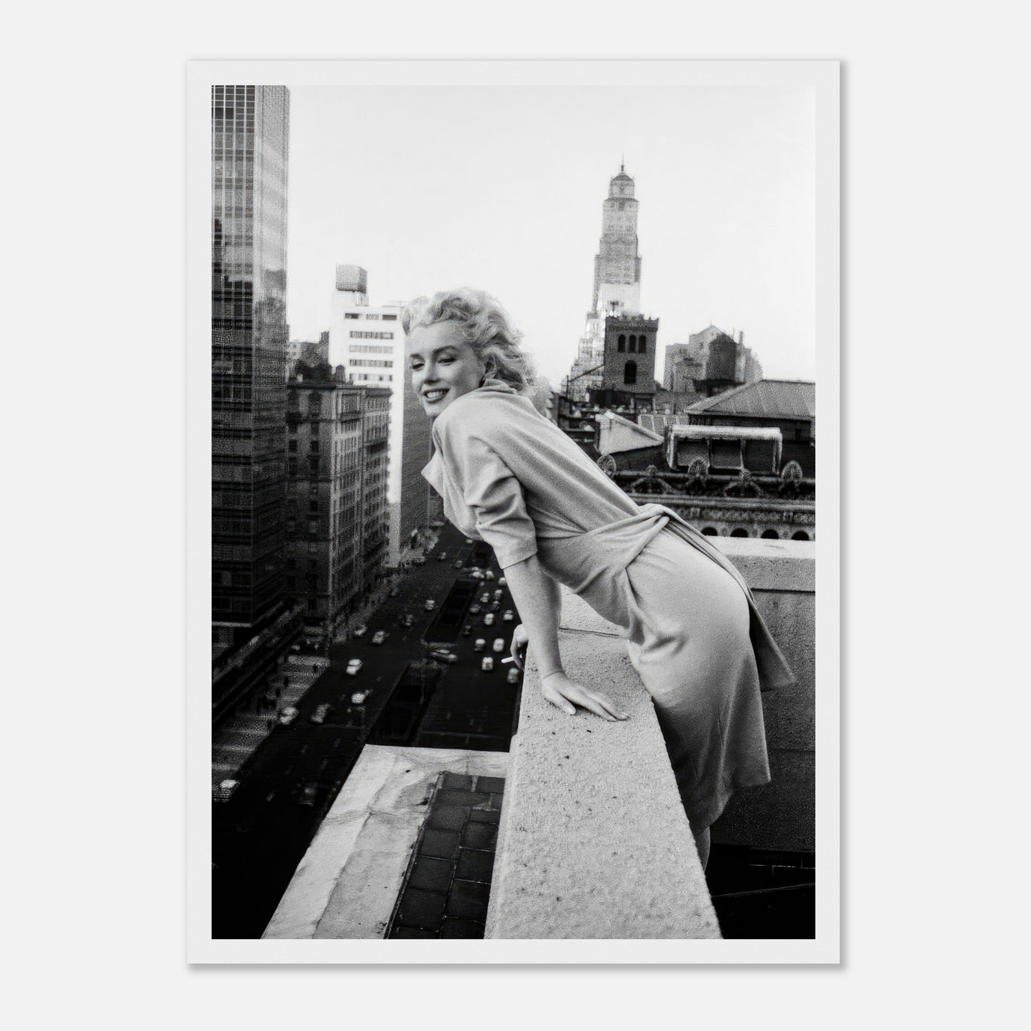 Marilyn Monroe smiling on a rooftop in New York City, captured in a classic black-and-white photograph.