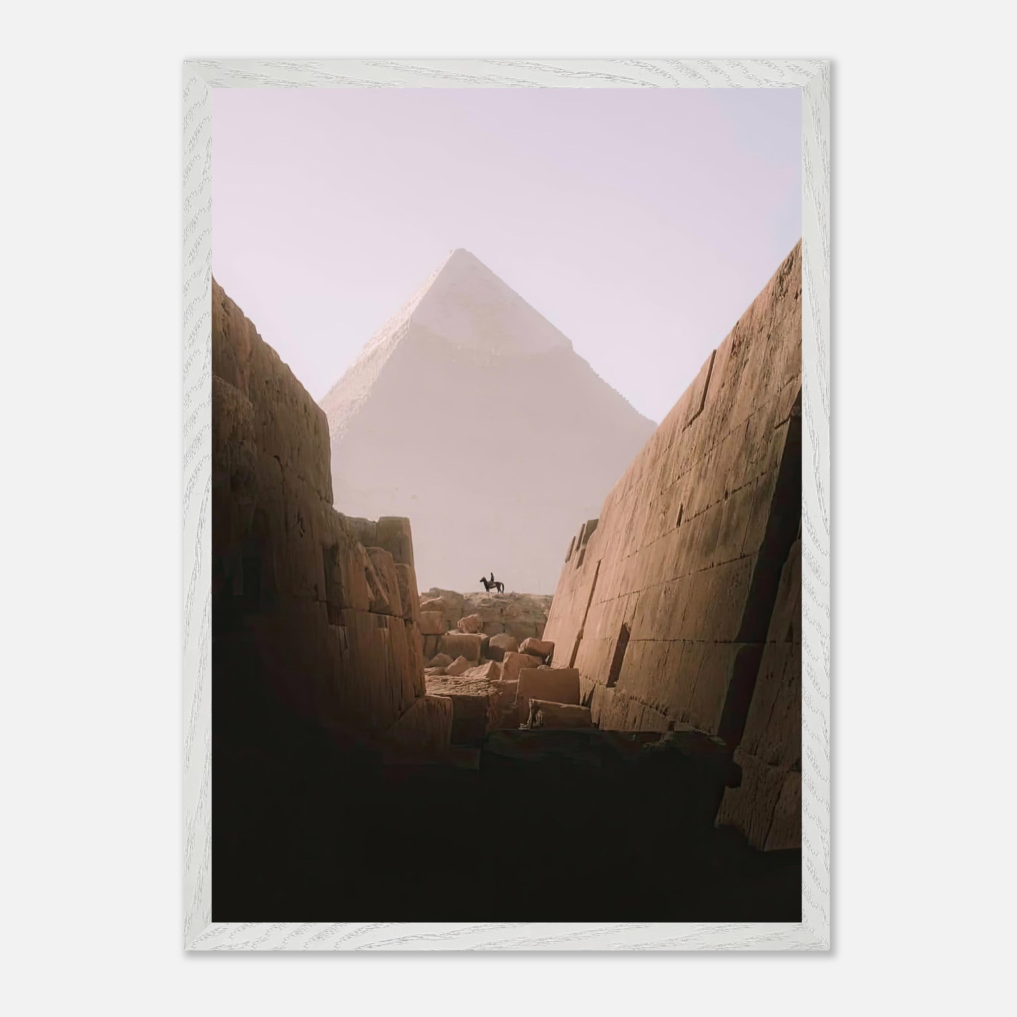 Vintage framed print of a lone rider against the Great Pyramid of Giza, capturing adventure and ancient beauty.