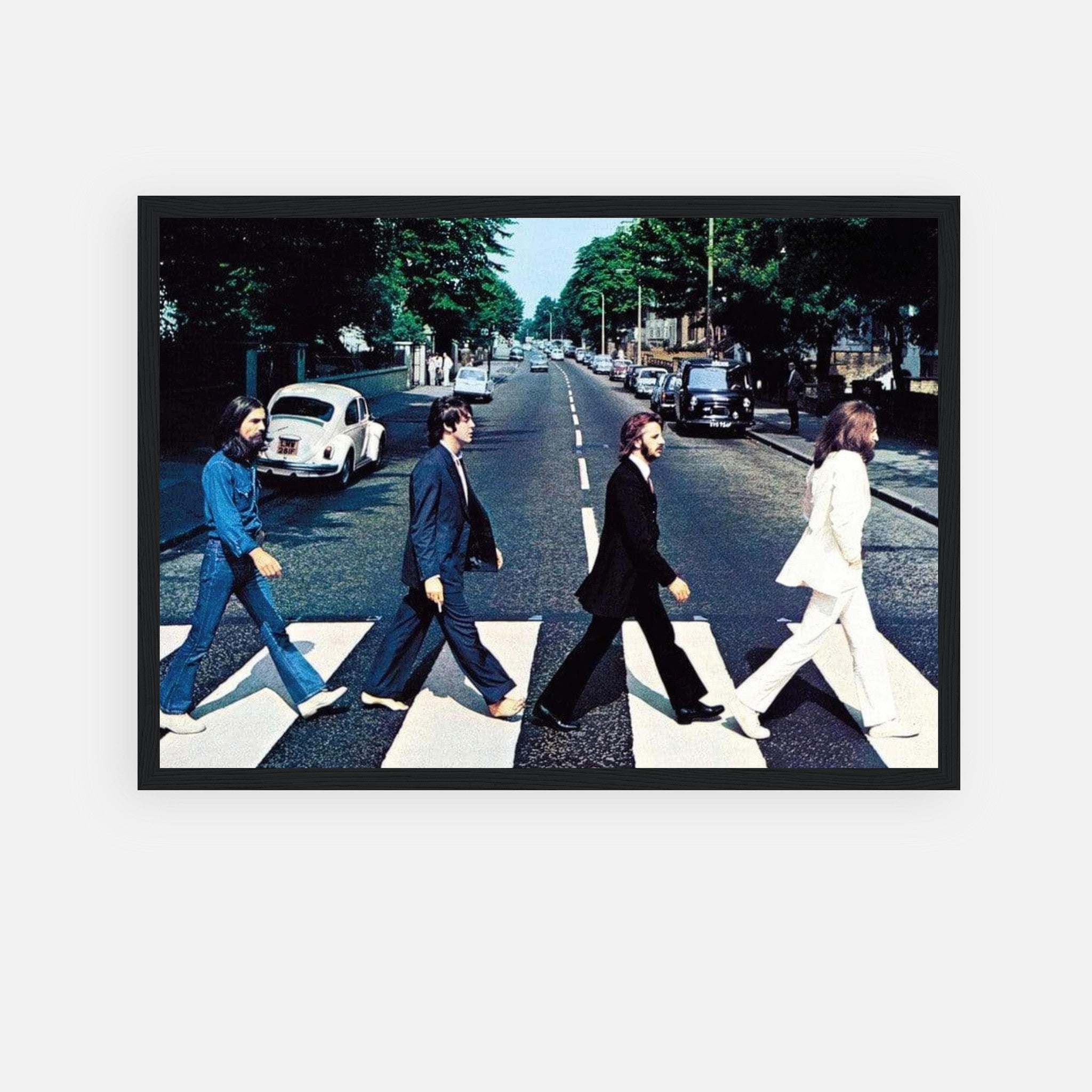 Framed print of The Beatles walking across Abbey Road, iconic album cover art, perfect for music lovers.