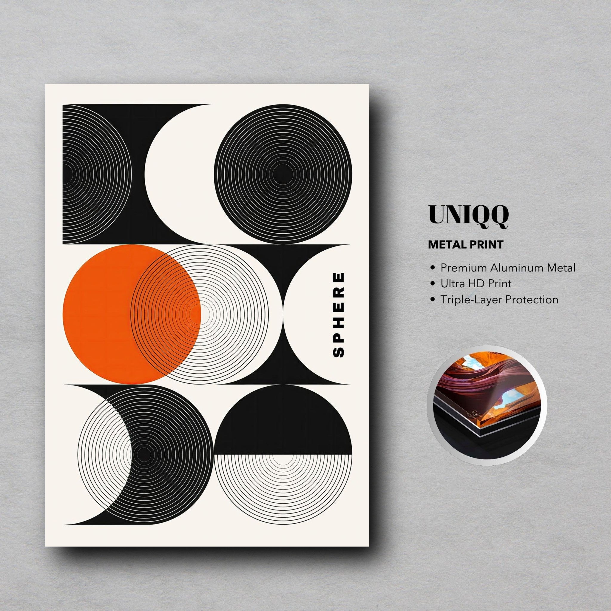 Abstract geometric sphere metal print featuring bold circles and vibrant orange accents on a sleek aluminum surface.