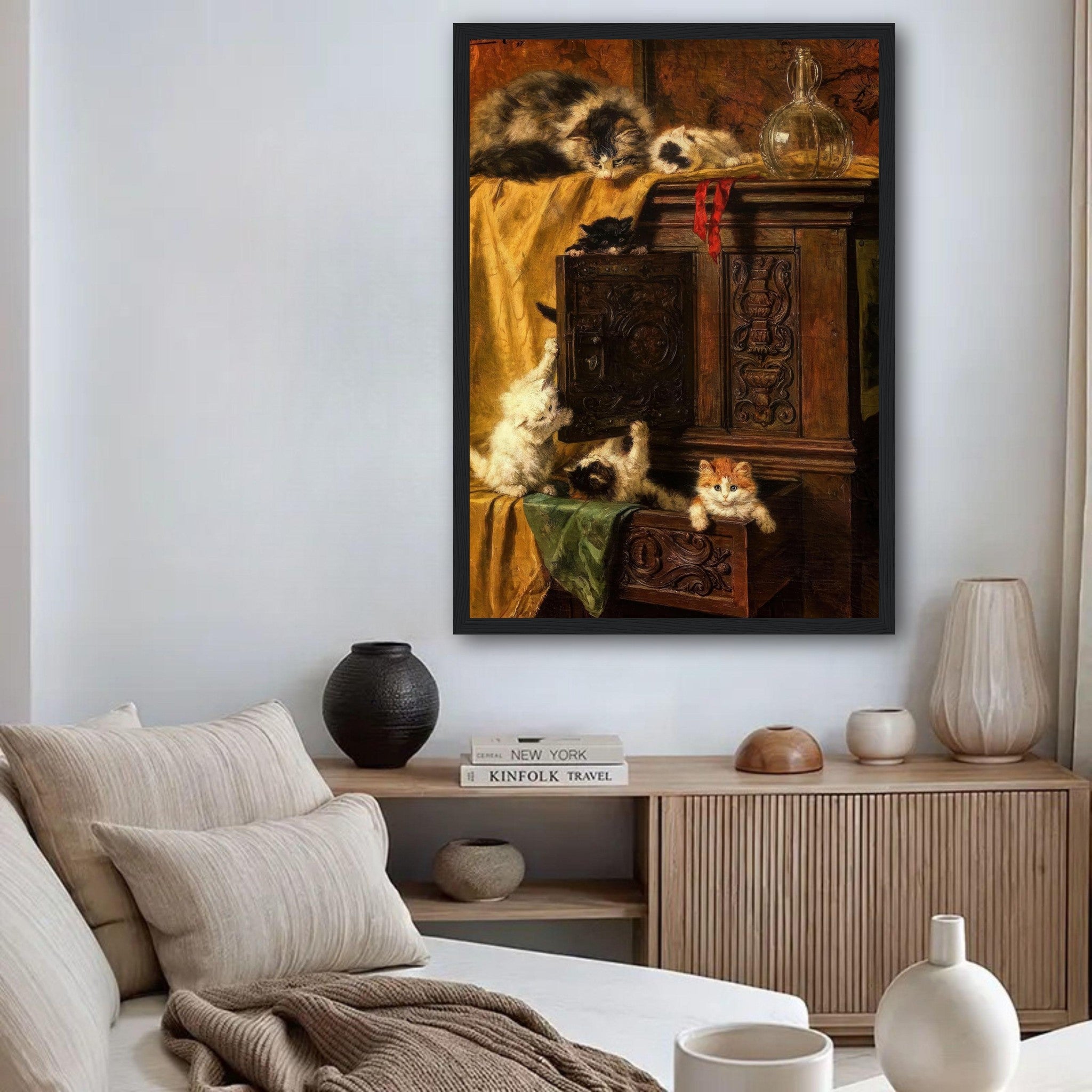 Vintage cat painting framed print showcasing playful kittens on an antique wooden cabinet in a cozy home setting.