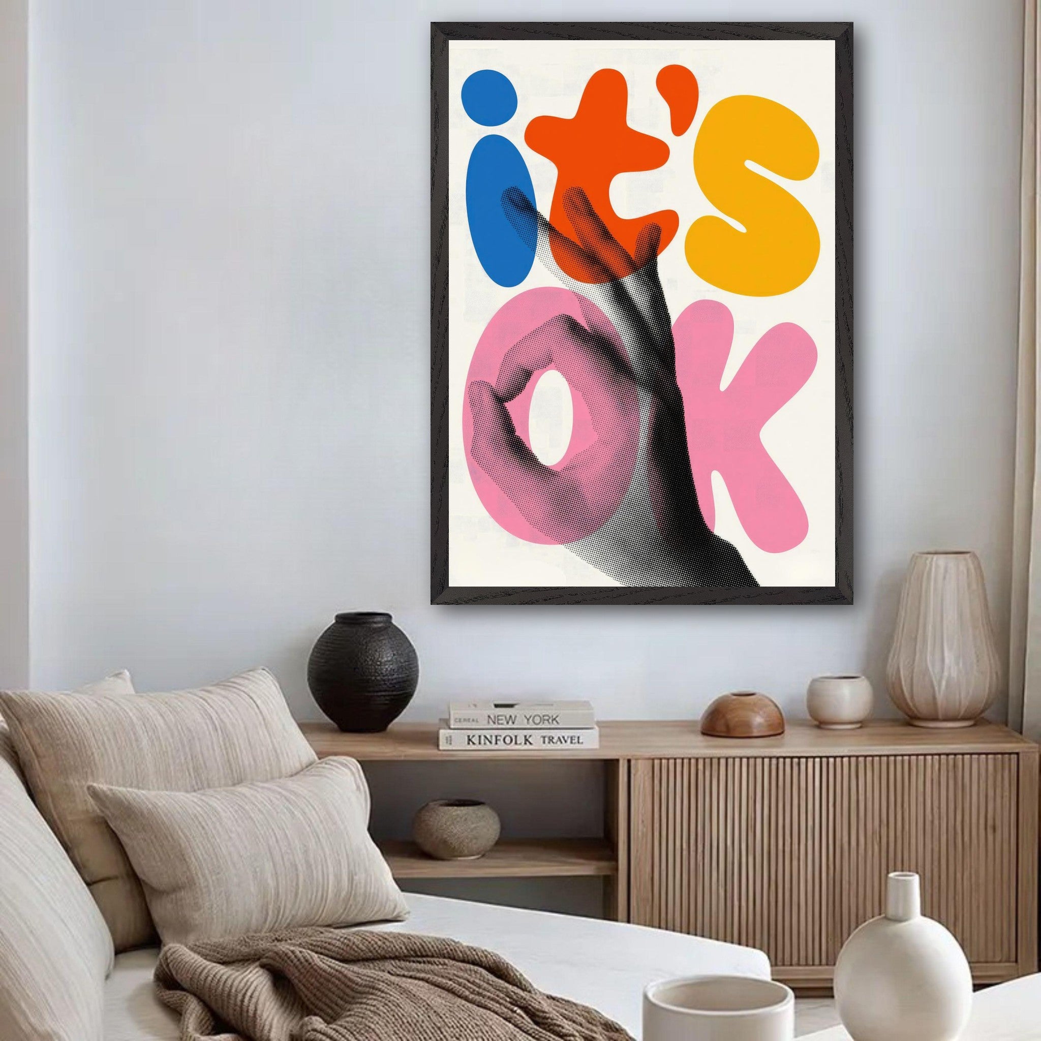 Retro abstract pop art print stating 'It's OK' with vibrant colors in a stylish living room setting.