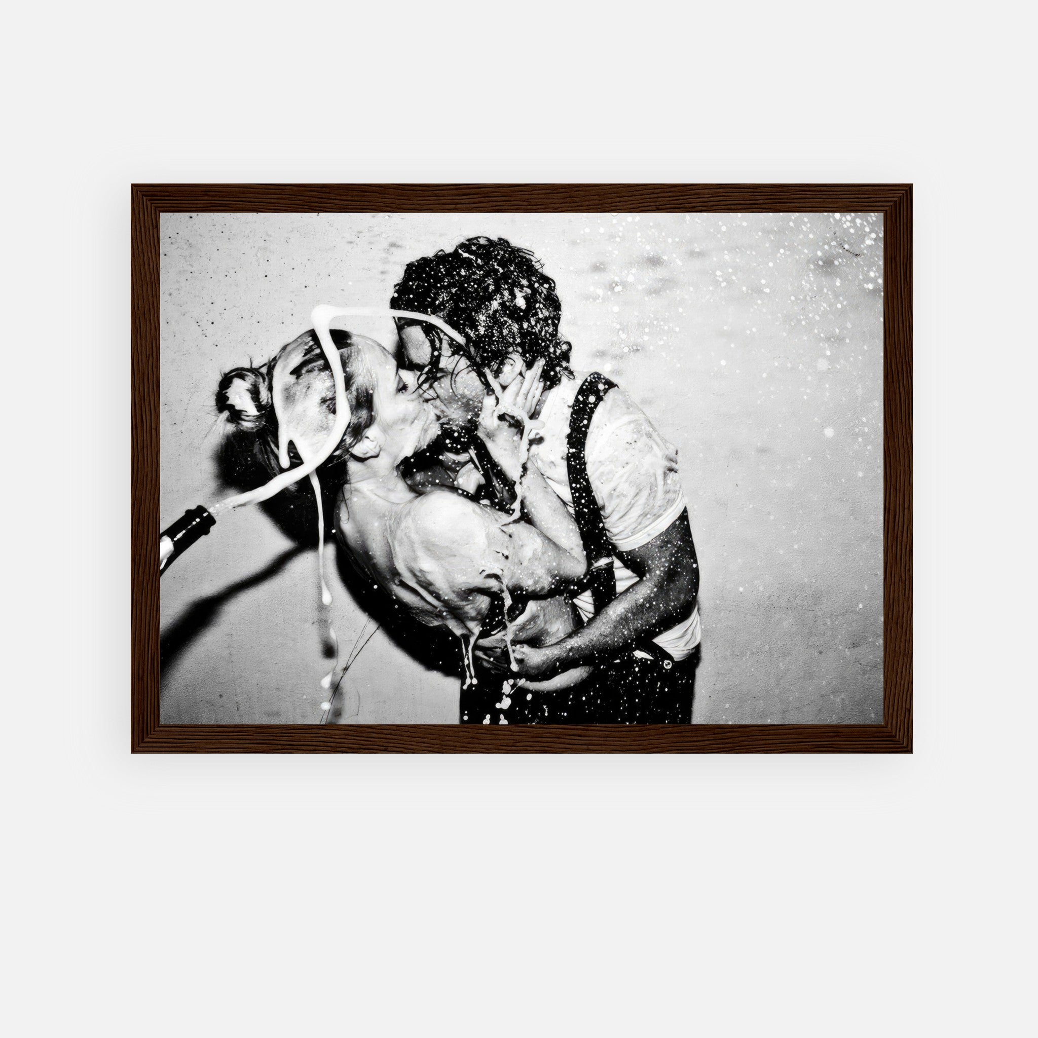 Framed print of a passionate kiss with champagne splash, featuring iconic black-and-white style.