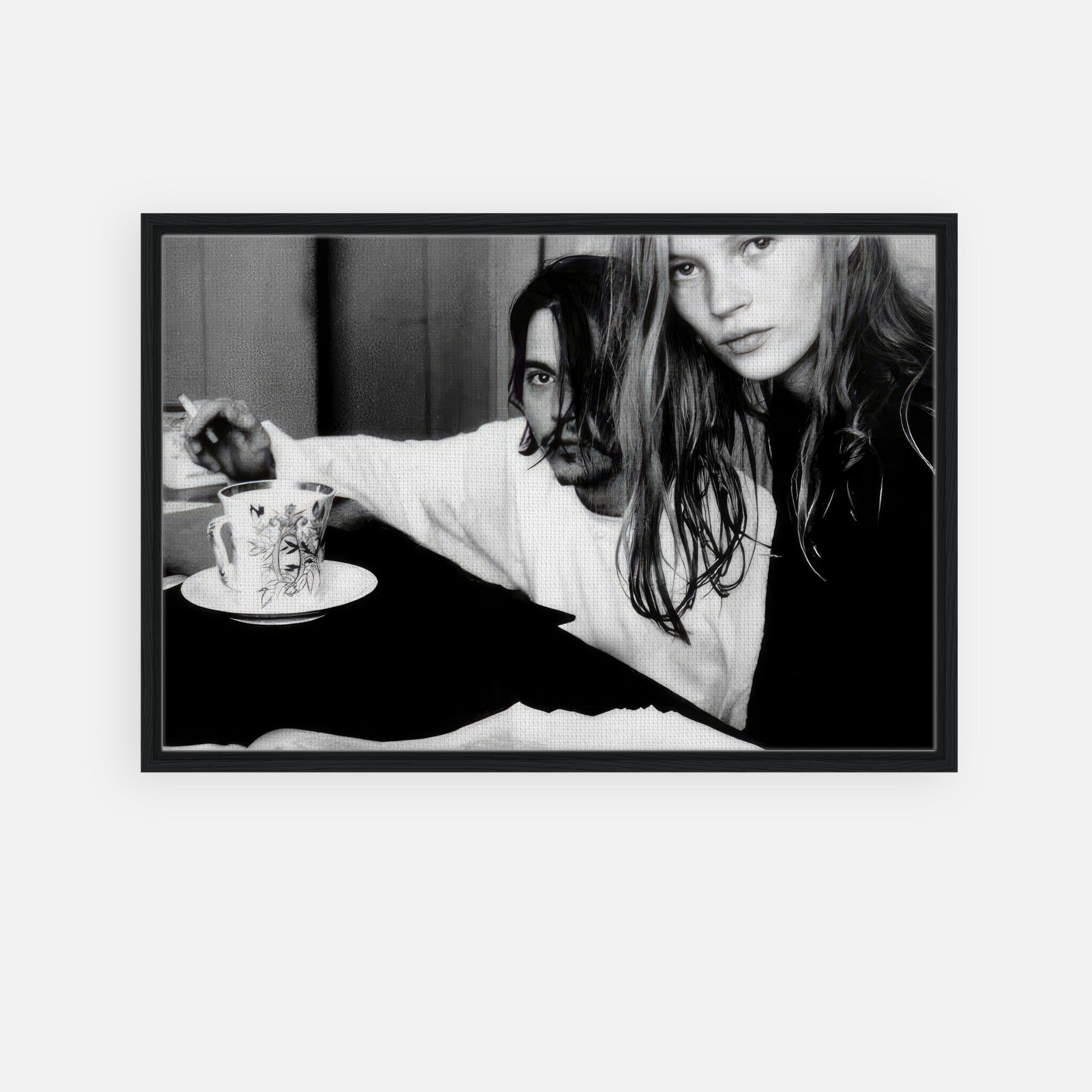 Rebel Romance framed canvas print featuring Johnny Depp and Kate Moss in a black-and-white photo, capturing 90s celebrity allure.