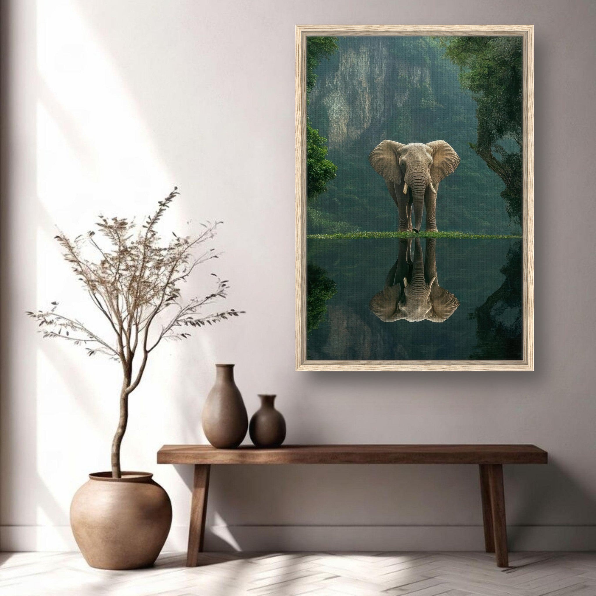 Framed canvas print of a majestic elephant by water, surrounded by lush greenery and cliffs, adding a wild touch to any decor.
