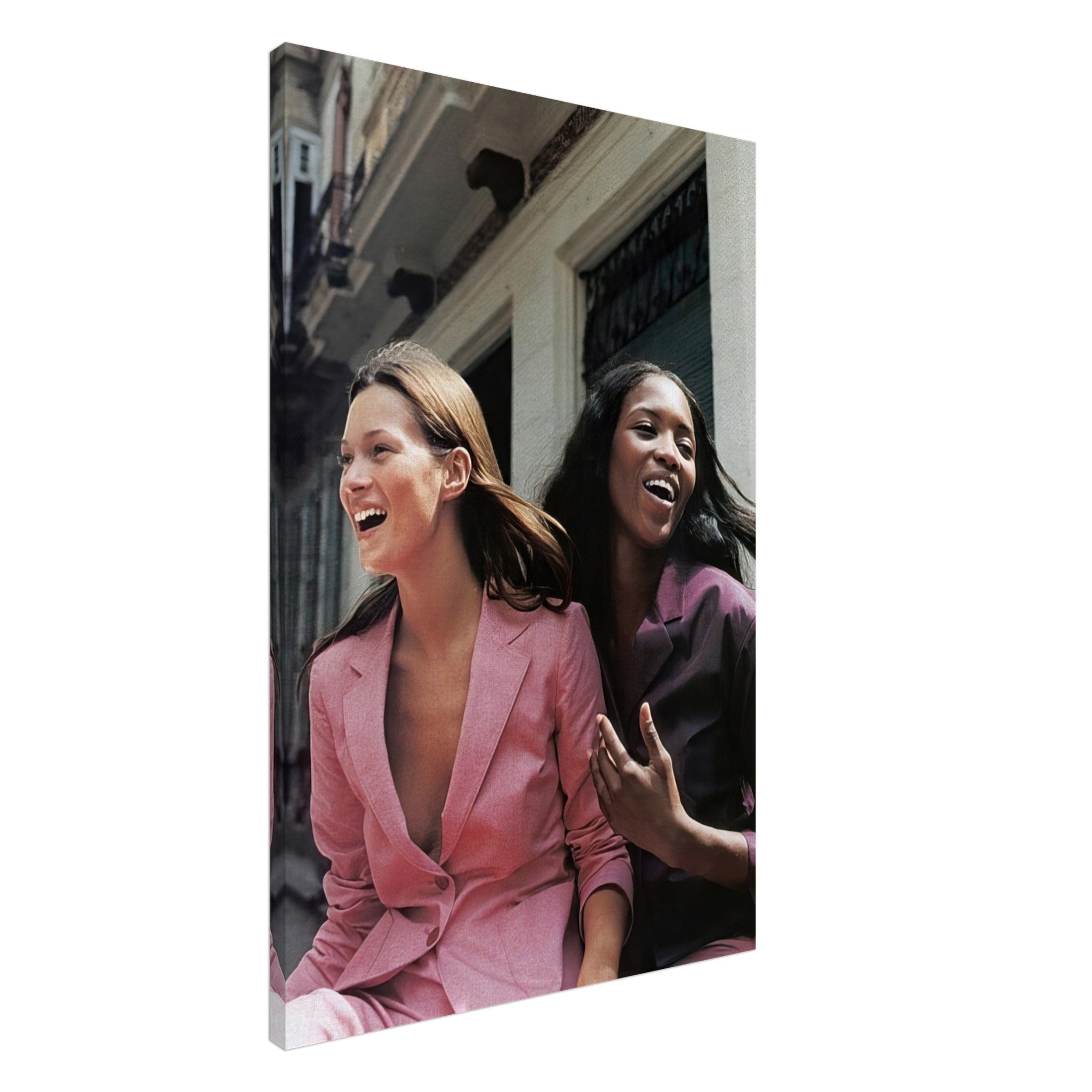 Naomi Campbell and Kate Moss smiling in stylish pink and dark outfits, captured in a timeless canvas print.