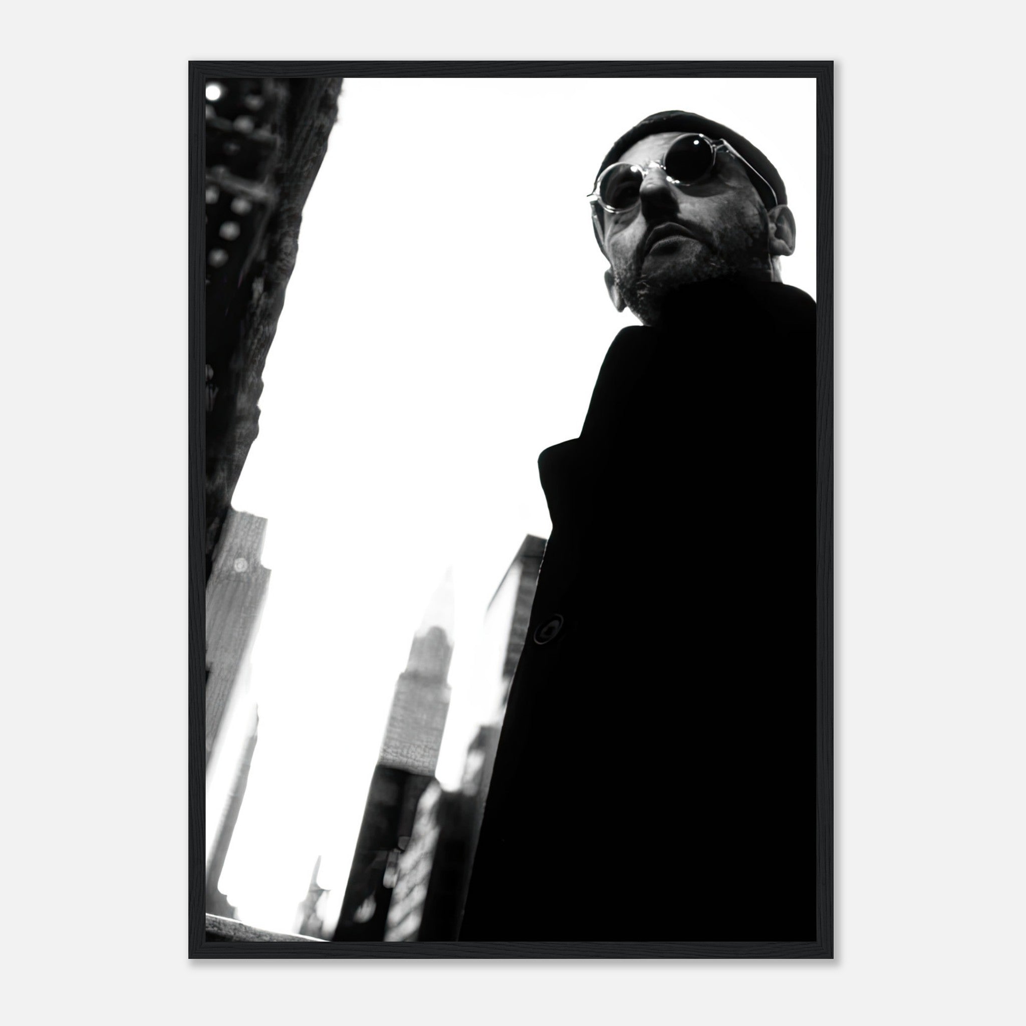 Jean Reno black-and-white framed print, iconic cinematic photography in urban setting.