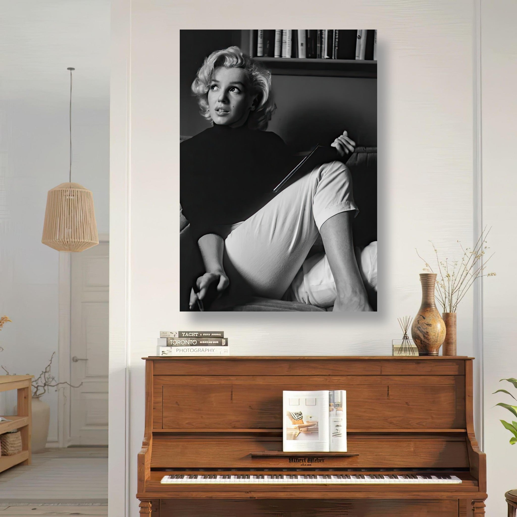 Marilyn Monroe black-and-white metal print of her reading a book in a stylish interior.