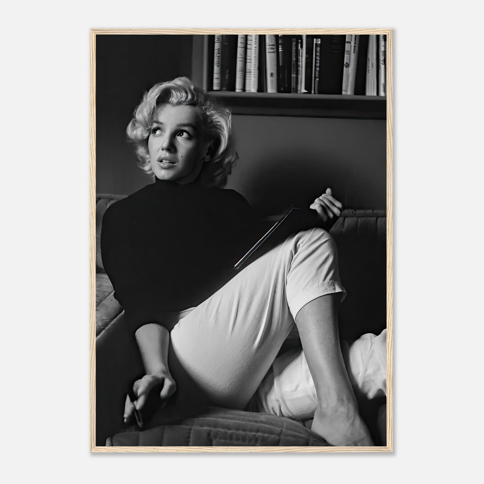 Marilyn Monroe framed print reading a book in black-and-white, adding elegance to any decor.