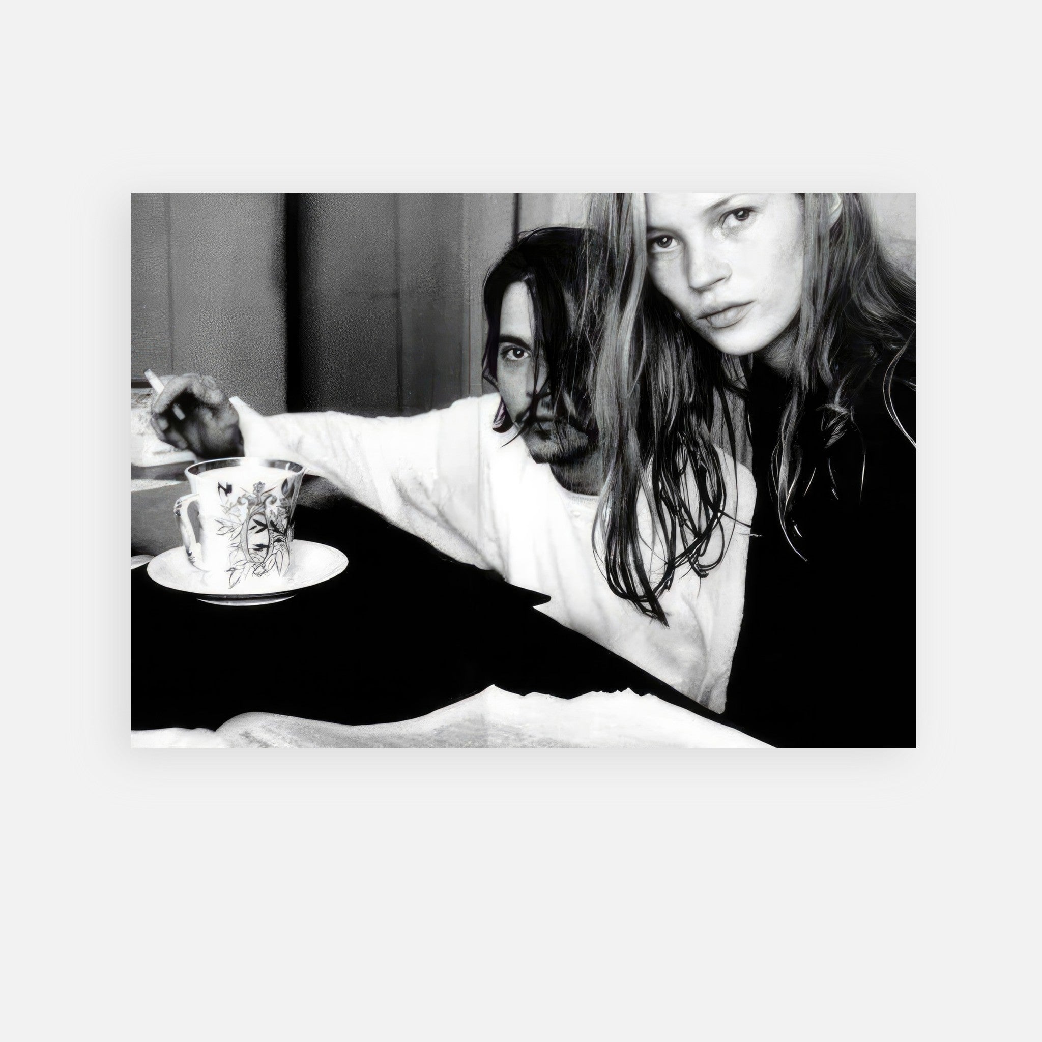 Black-and-white poster of Johnny Depp and Kate Moss capturing 90s rock-and-roll romance aesthetic.
