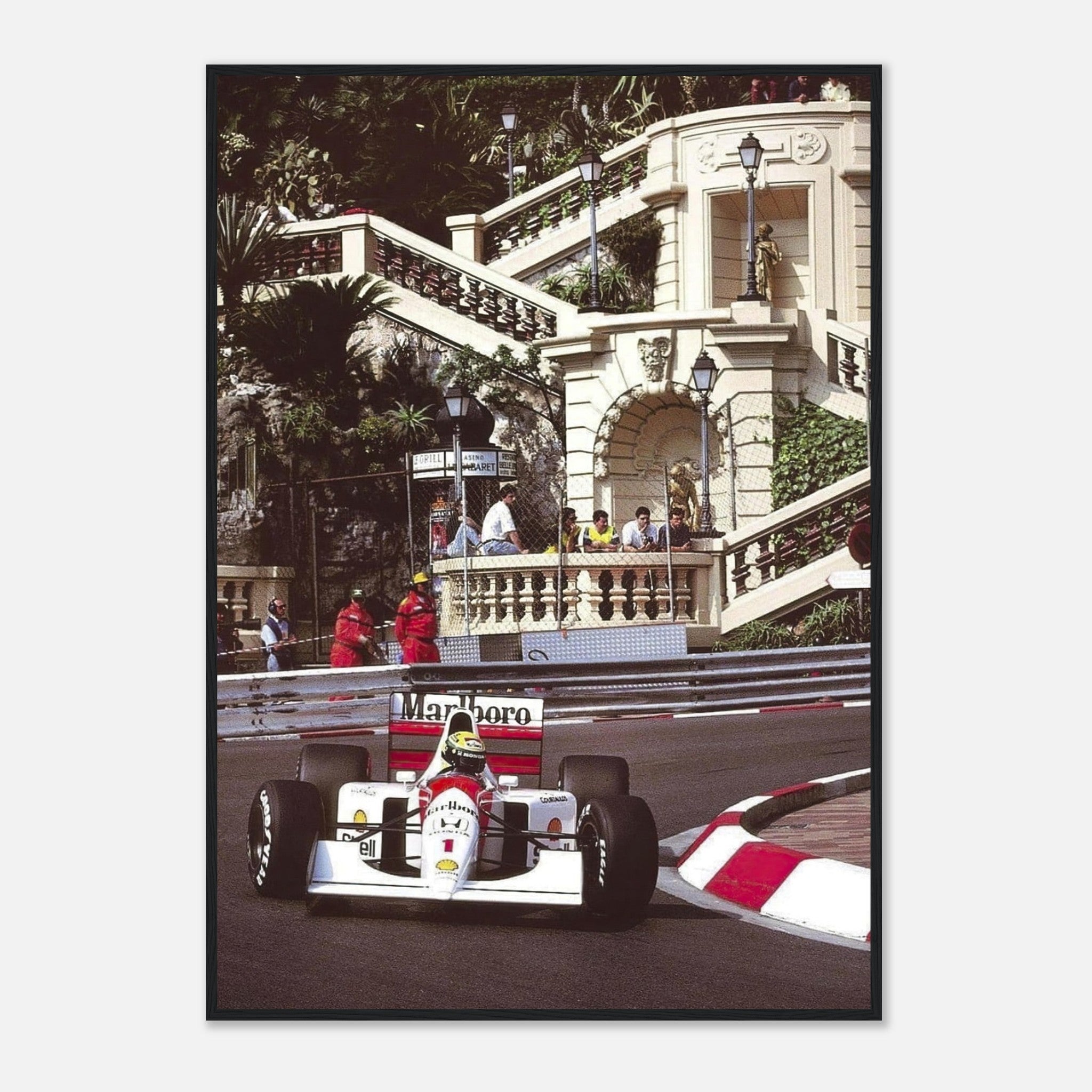 Ayrton Senna racing at Monaco Grand Prix, framed print showcasing his iconic moment in a sleek Black frame.