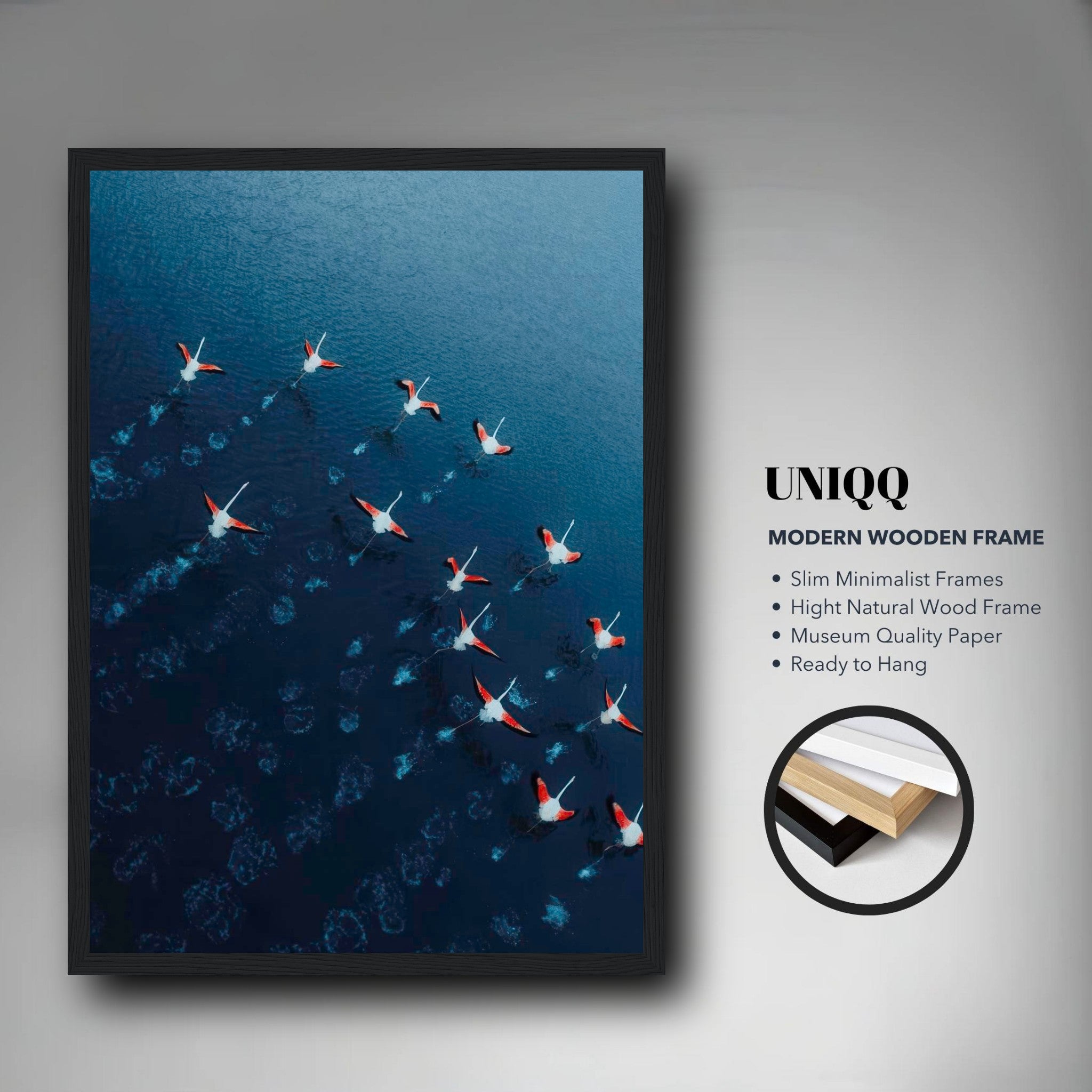 Aerial view of flamingos in flight over blue waters in a modern wooden frame, perfect for home decor.