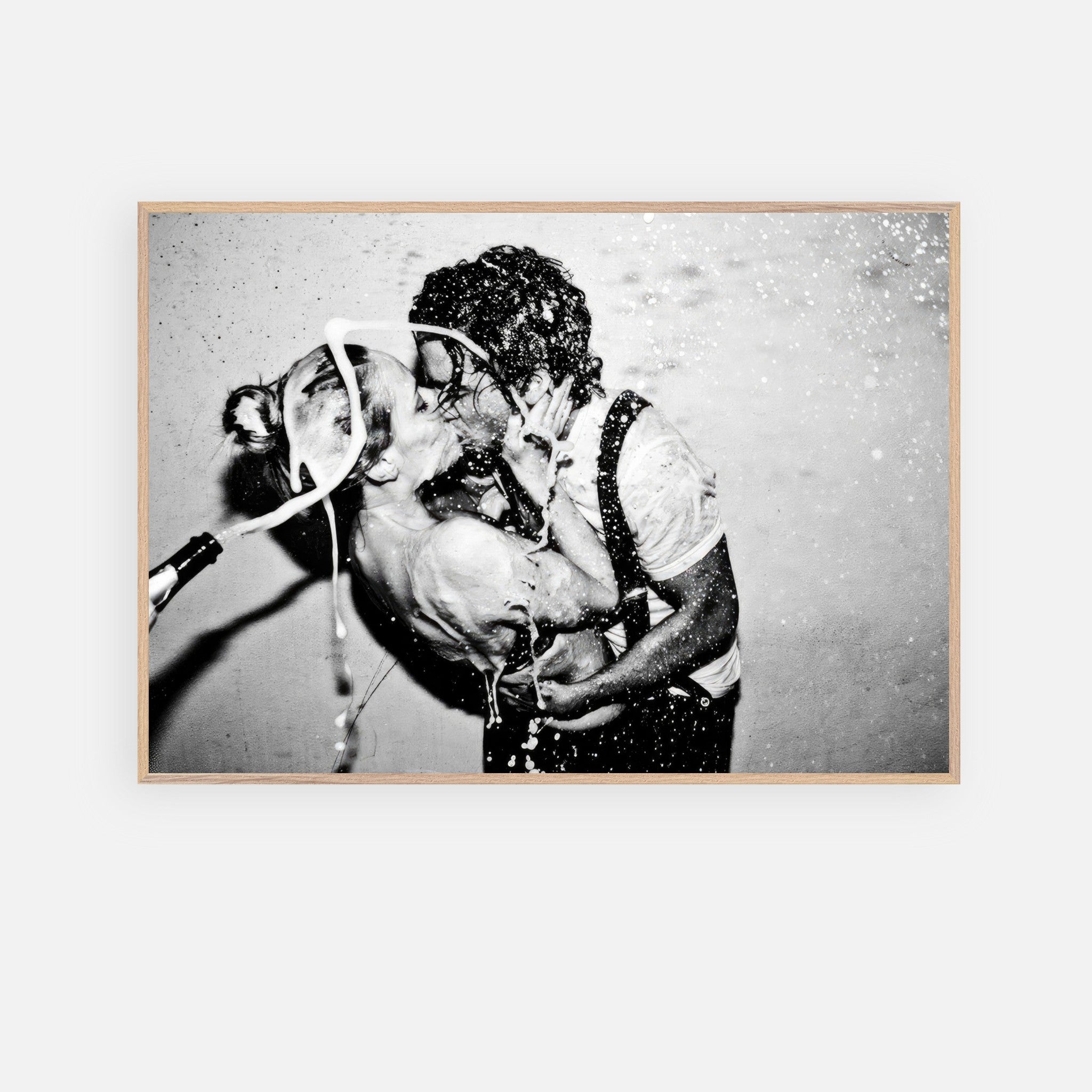 Black-and-white fine art print of Johnny Depp and Kate Moss sharing a passionate kiss, captured in a moment of romance.