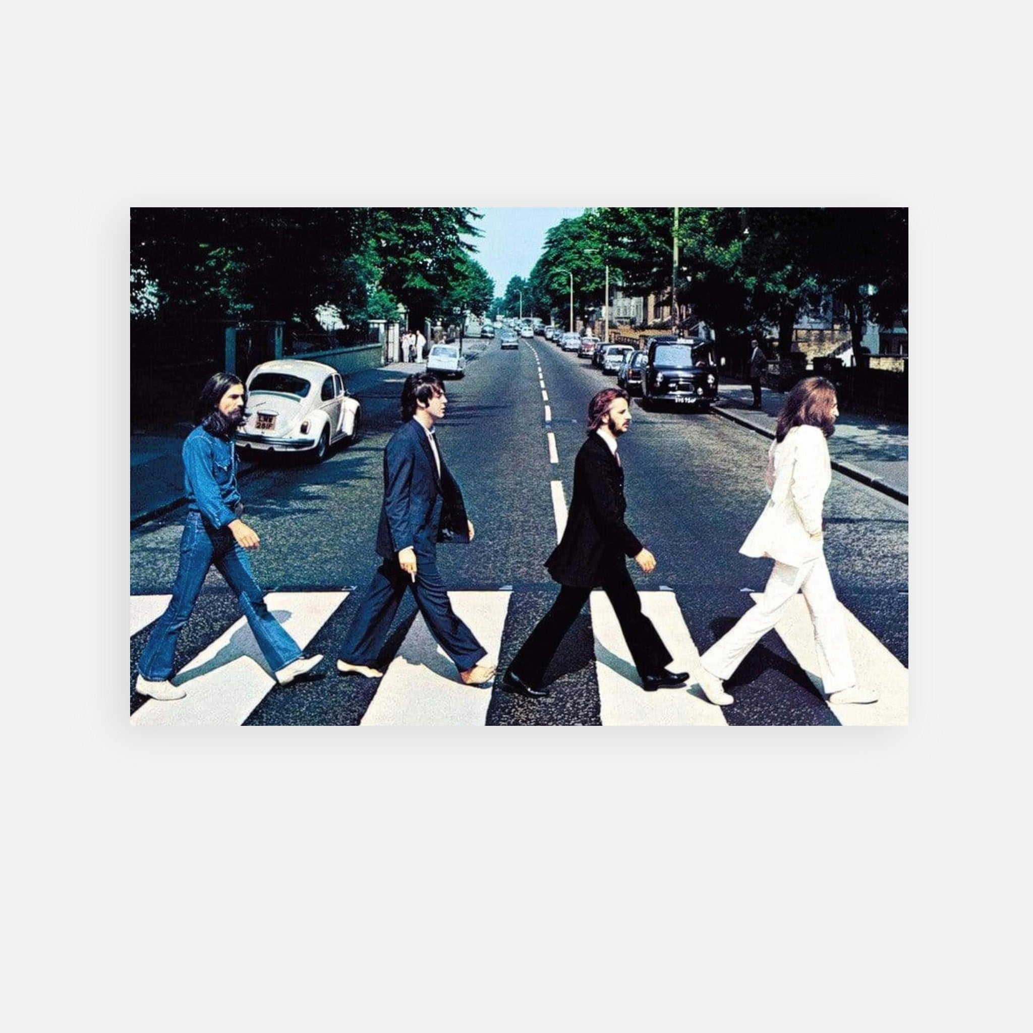 The Beatles Abbey Road metal print featuring iconic crossing scene with band members on zebra crossing.