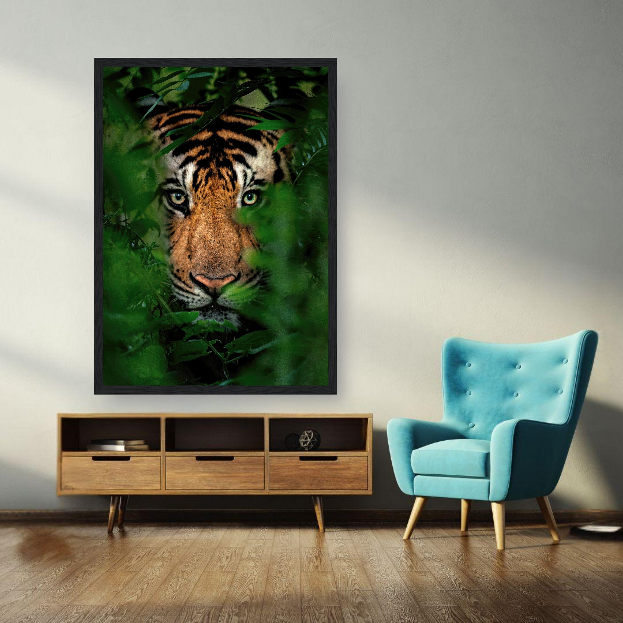 Framed print of a tiger peering through lush jungle foliage, adding wildlife elegance to home decor.