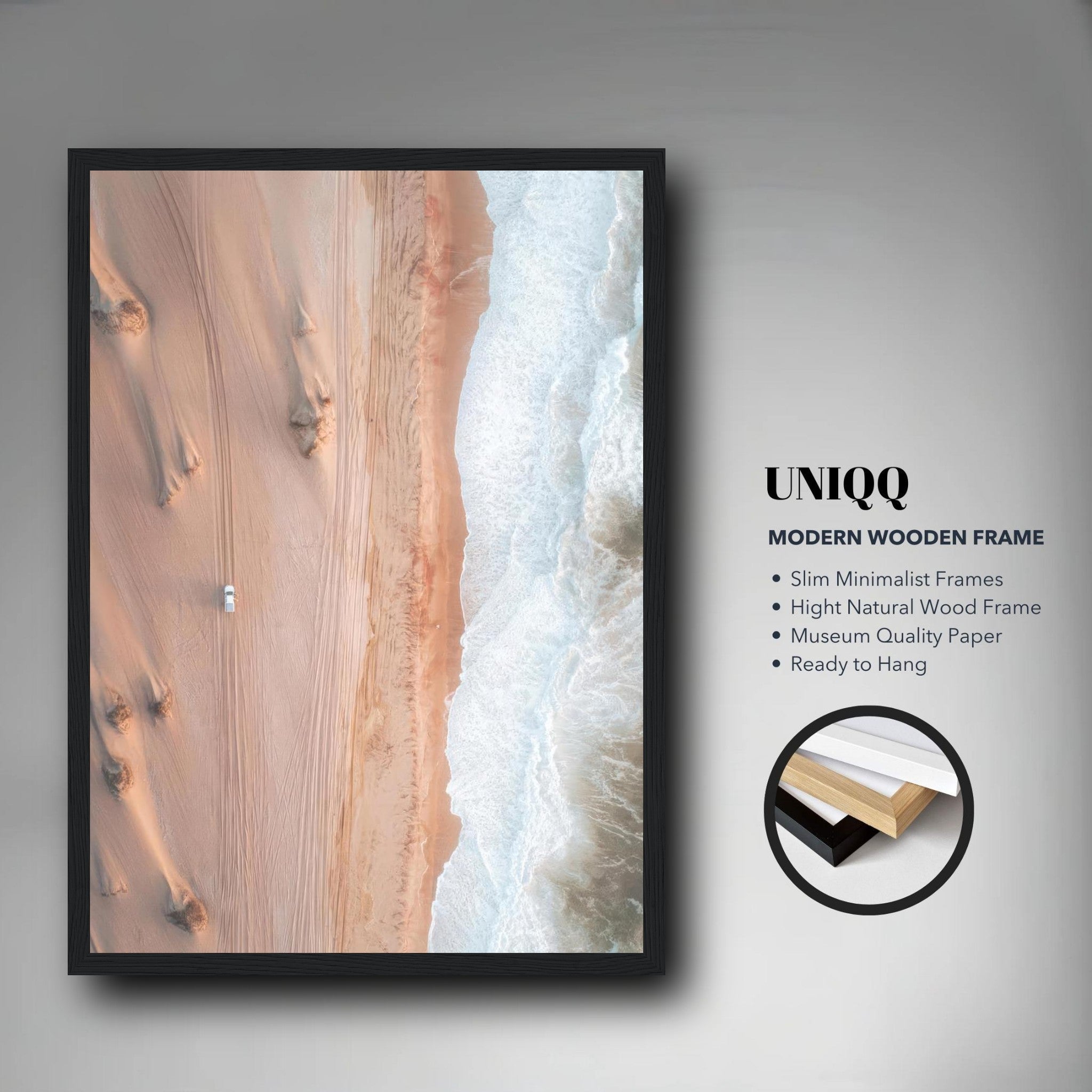 Framed print of desert meeting ocean with a modern wooden frame, showcasing breathtaking aerial drone photography.
