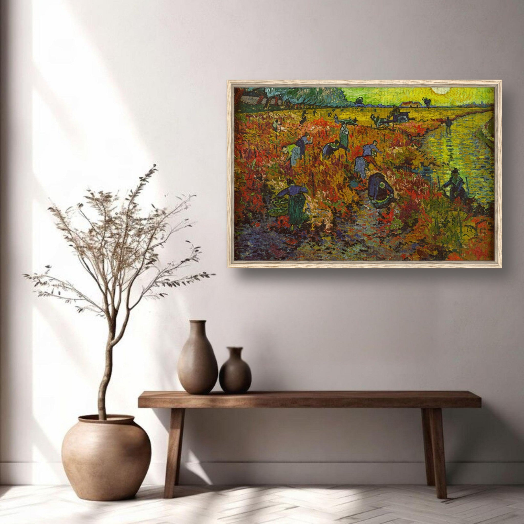 Framed canvas print of Van Gogh's The Red Vineyard, showcasing vibrant reds and golds in a sunlit vineyard scene.