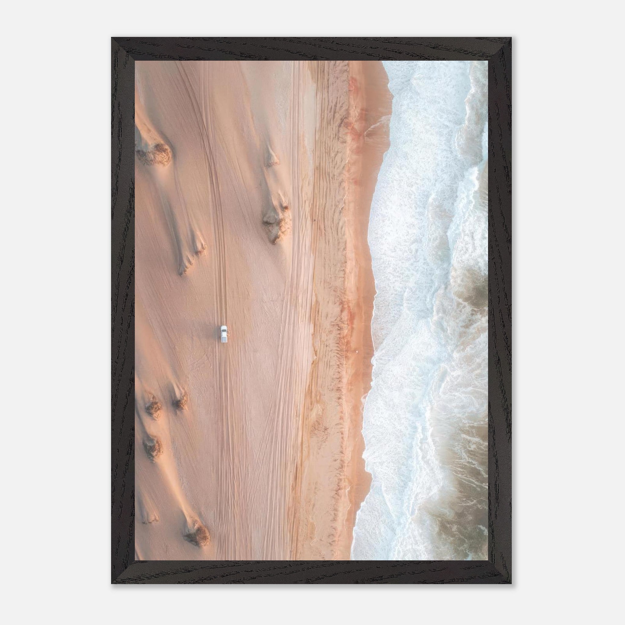 Aerial view of desert dunes and ocean waves in a vintage framed print titled 'Where Desert Meets Ocean'.