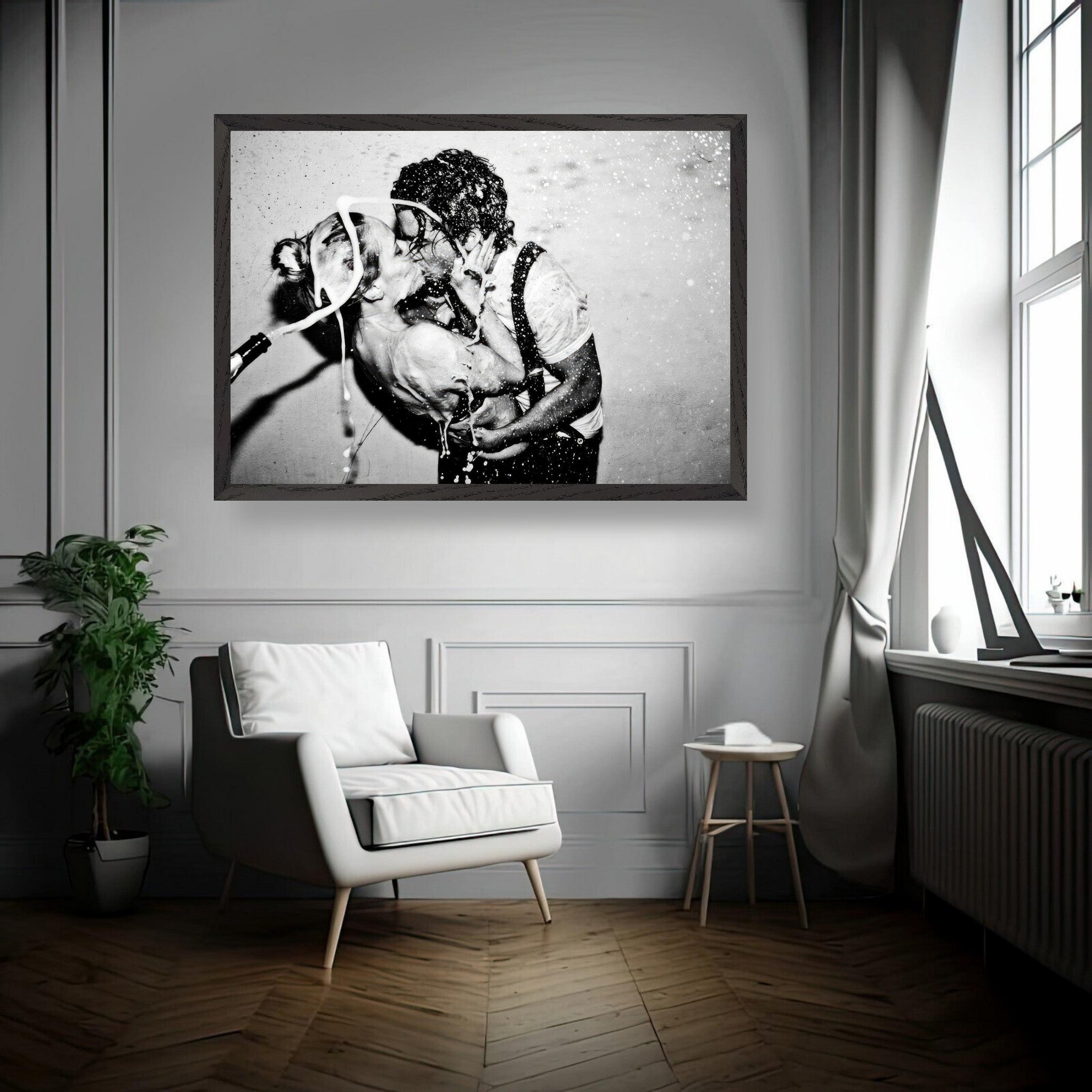 Black-and-white fine art print of Johnny Depp and Kate Moss in an intimate kiss, displayed in a contemporary room setting.