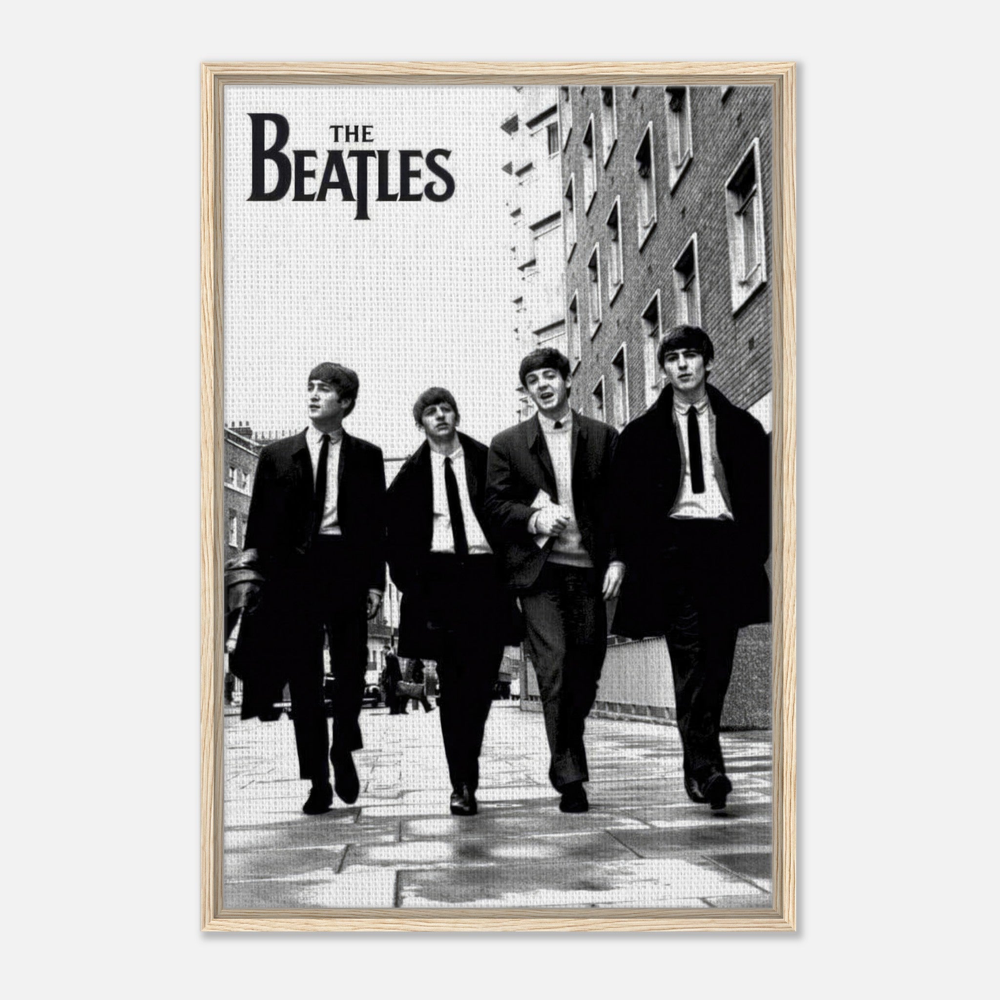 Framed canvas print of The Beatles walking in black and white, featuring classic 1960s style.