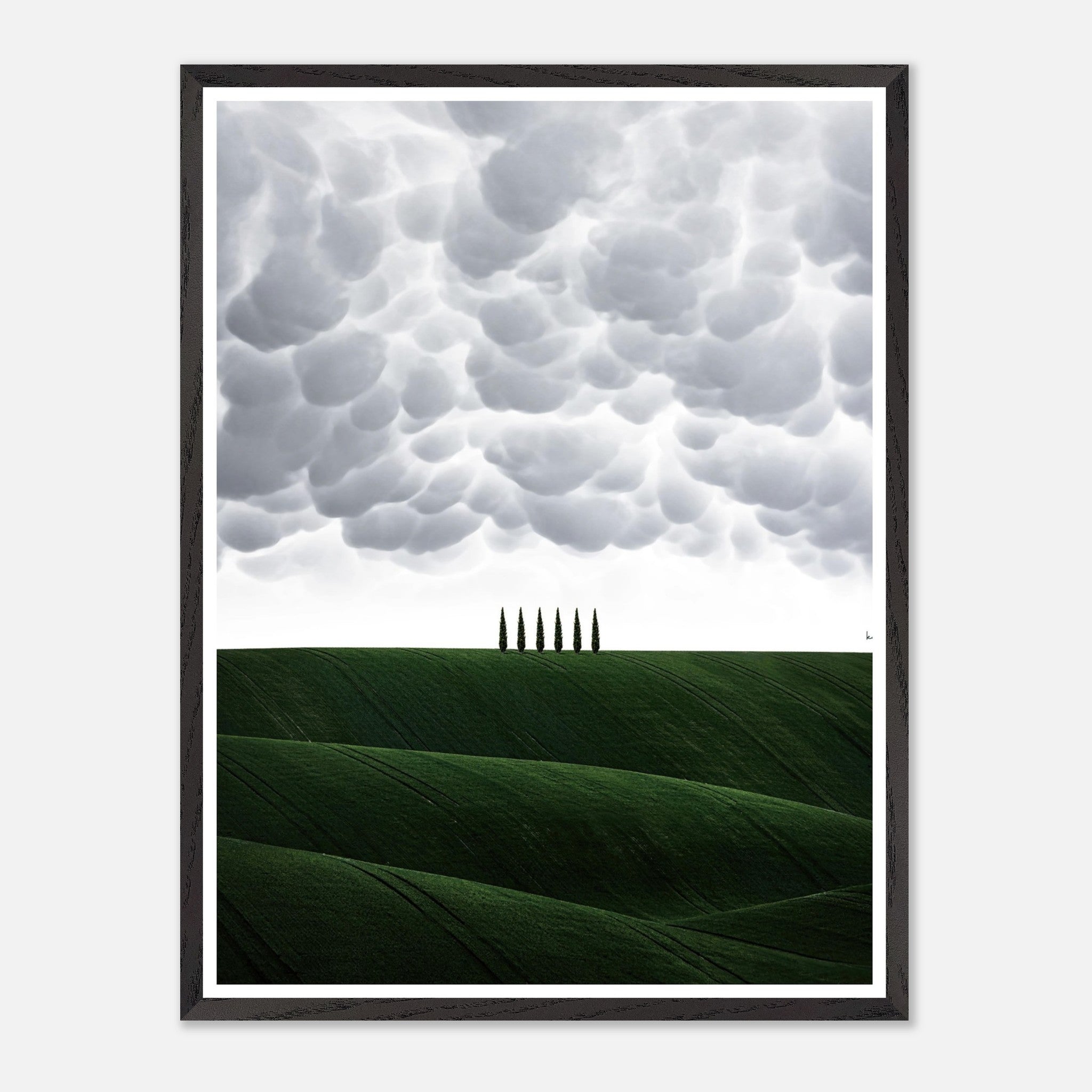 Toscana vintage framed art featuring green hills and cypress trees under dramatic clouds. Perfect for enhancing living spaces.