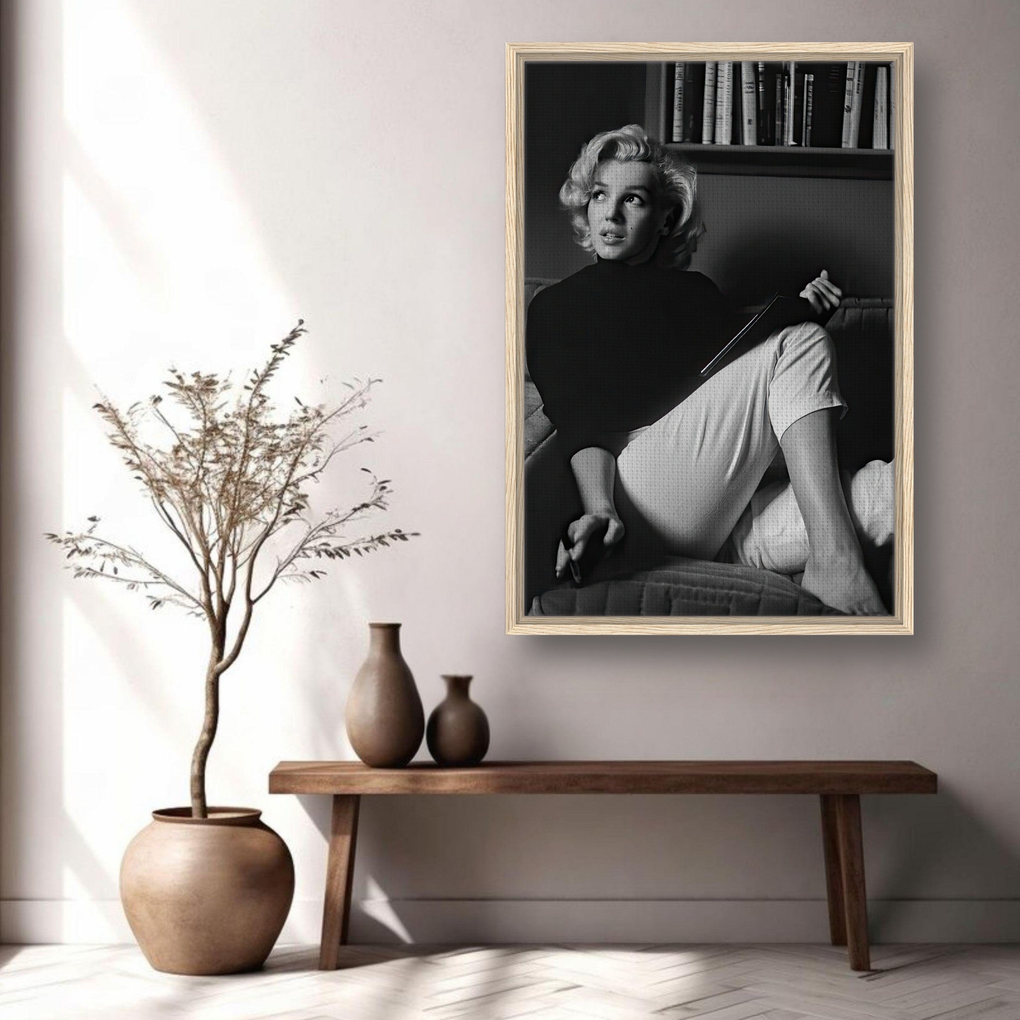 Marilyn Monroe reading a book, framed black-and-white canvas print, elegant home decor centerpiece.
