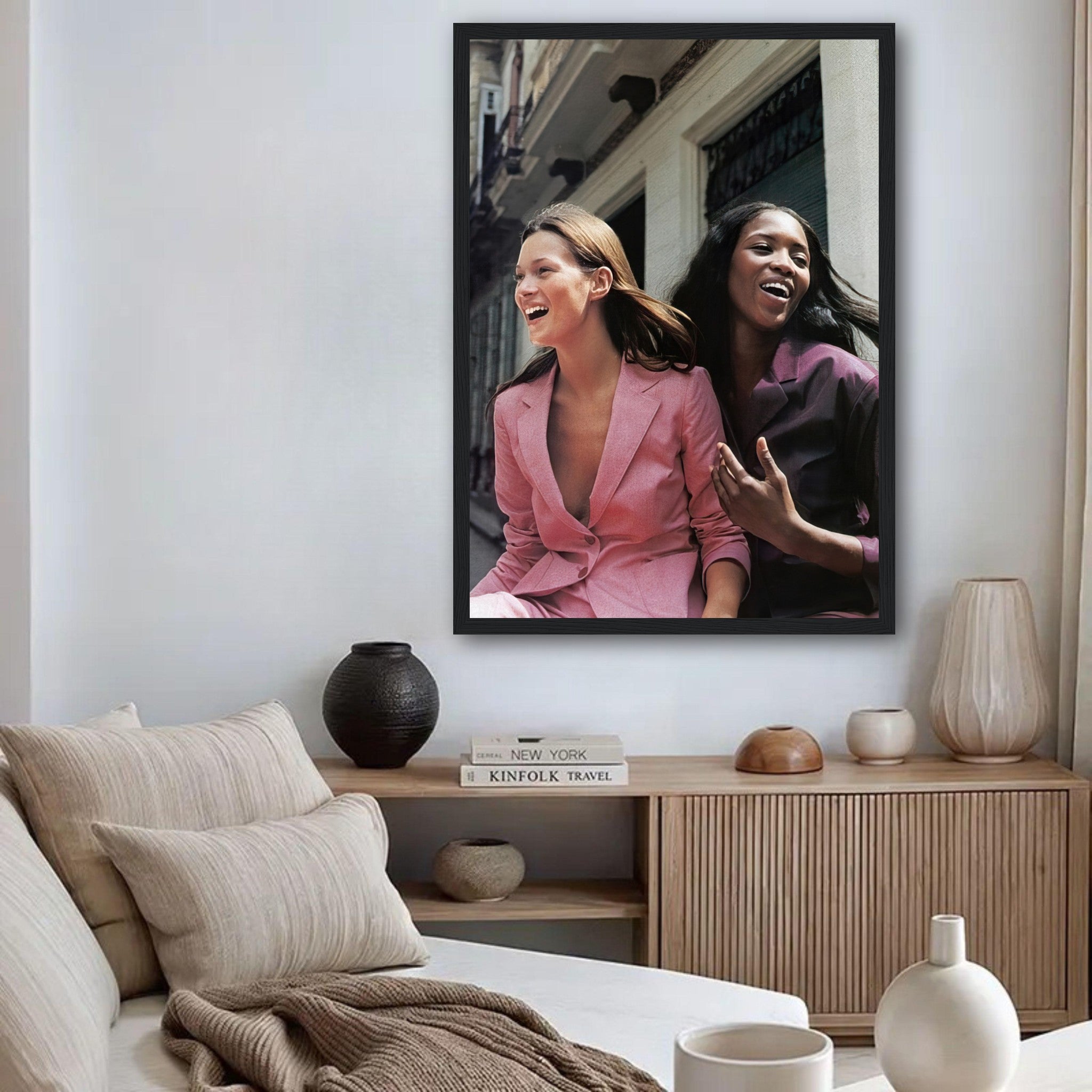 Framed print of Naomi Campbell and Kate Moss celebrating fashion in a stylish living room setting.