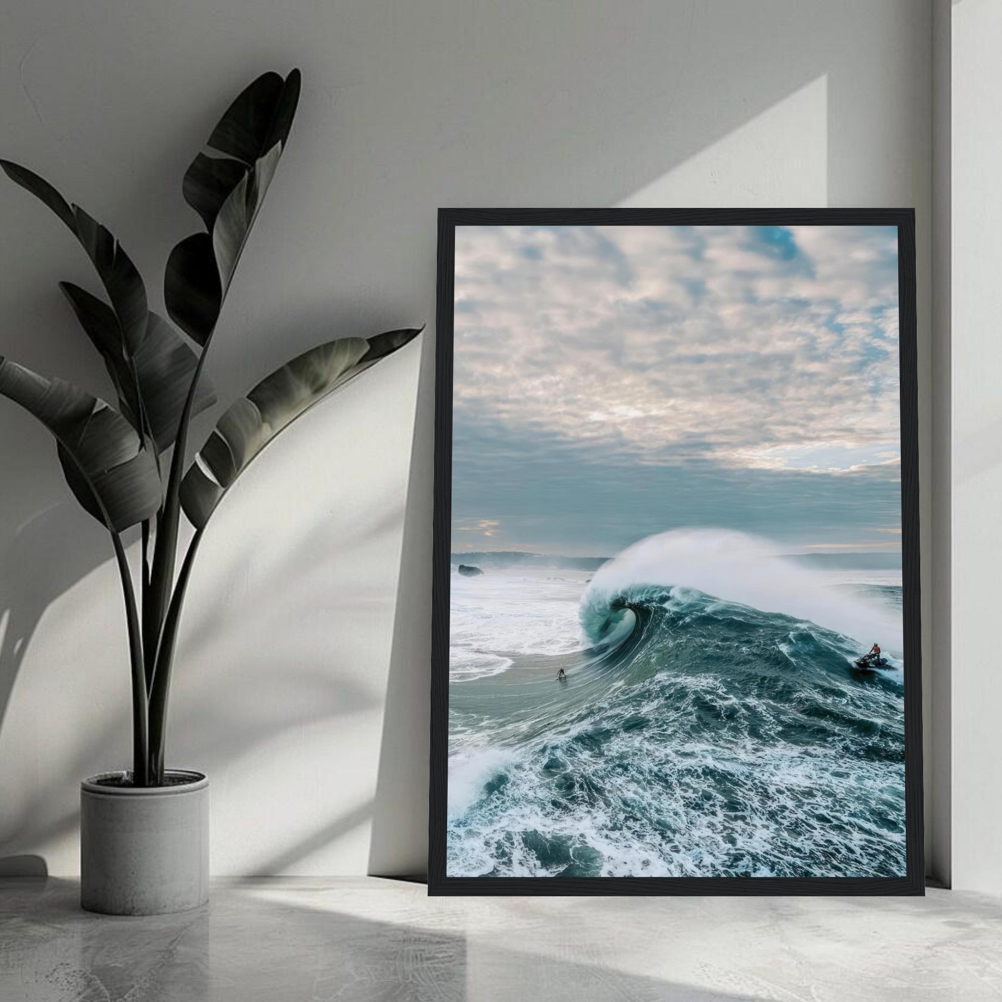 Framed print of big wave surfing, showcasing a surfer riding a massive wave against a dramatic sky.
