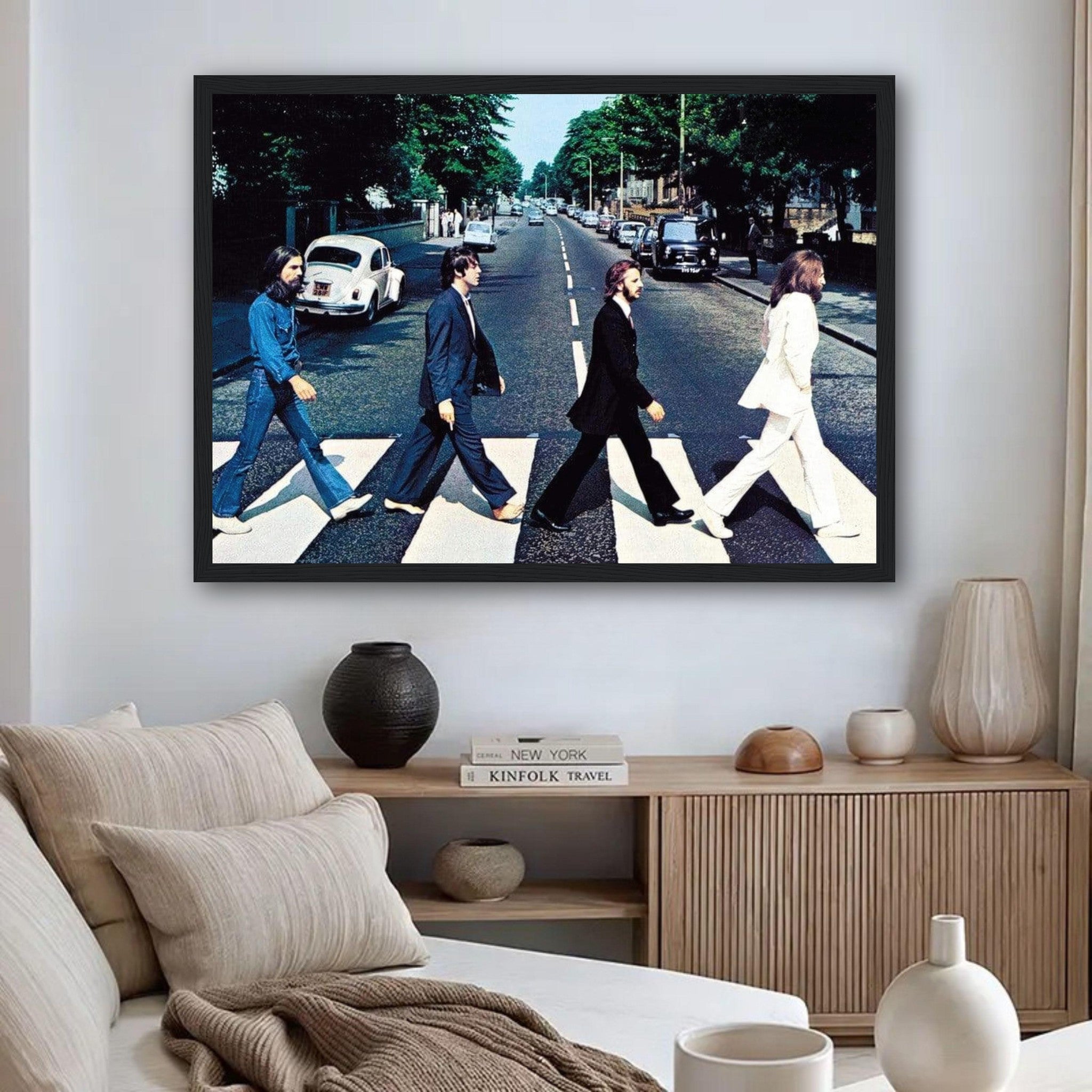 Framed print of The Beatles crossing Abbey Road, showcasing iconic album cover in a modern living room setting.