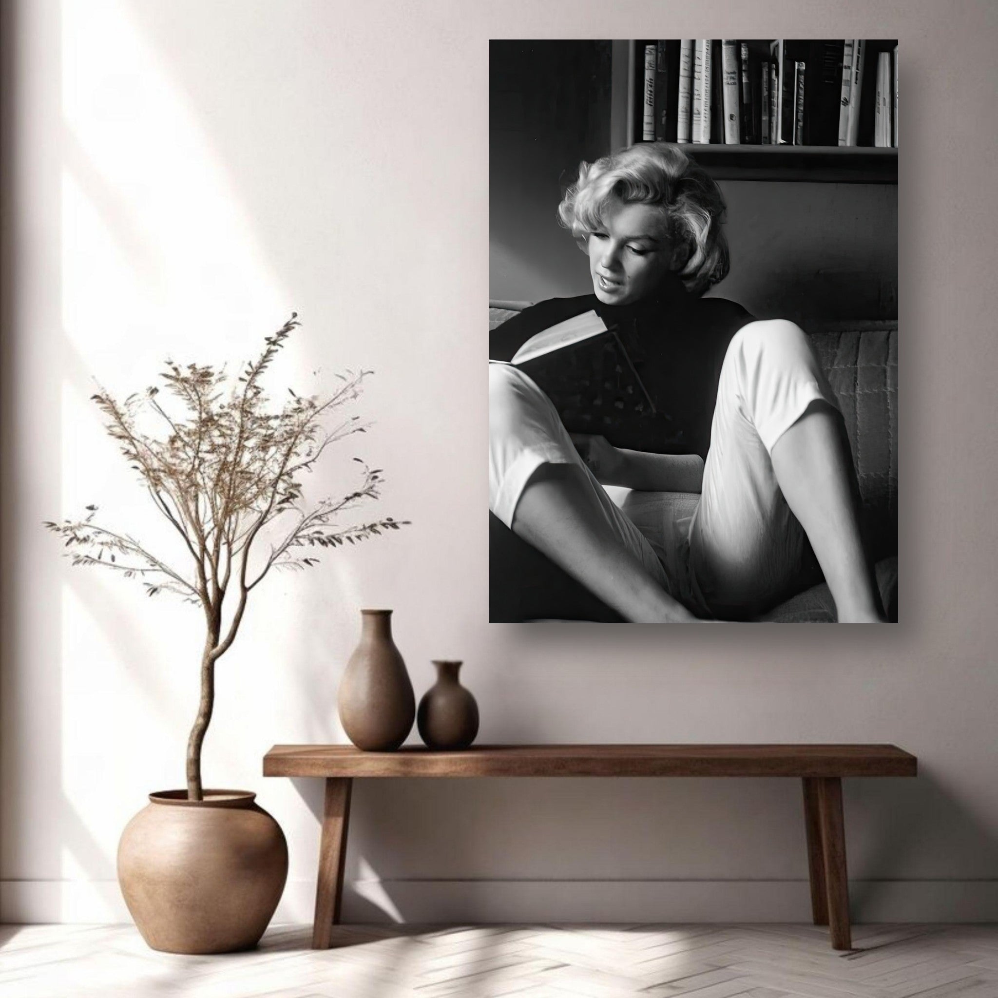 Marilyn Monroe reading at home in black-and-white, metal print wall art showcasing elegance and grace.