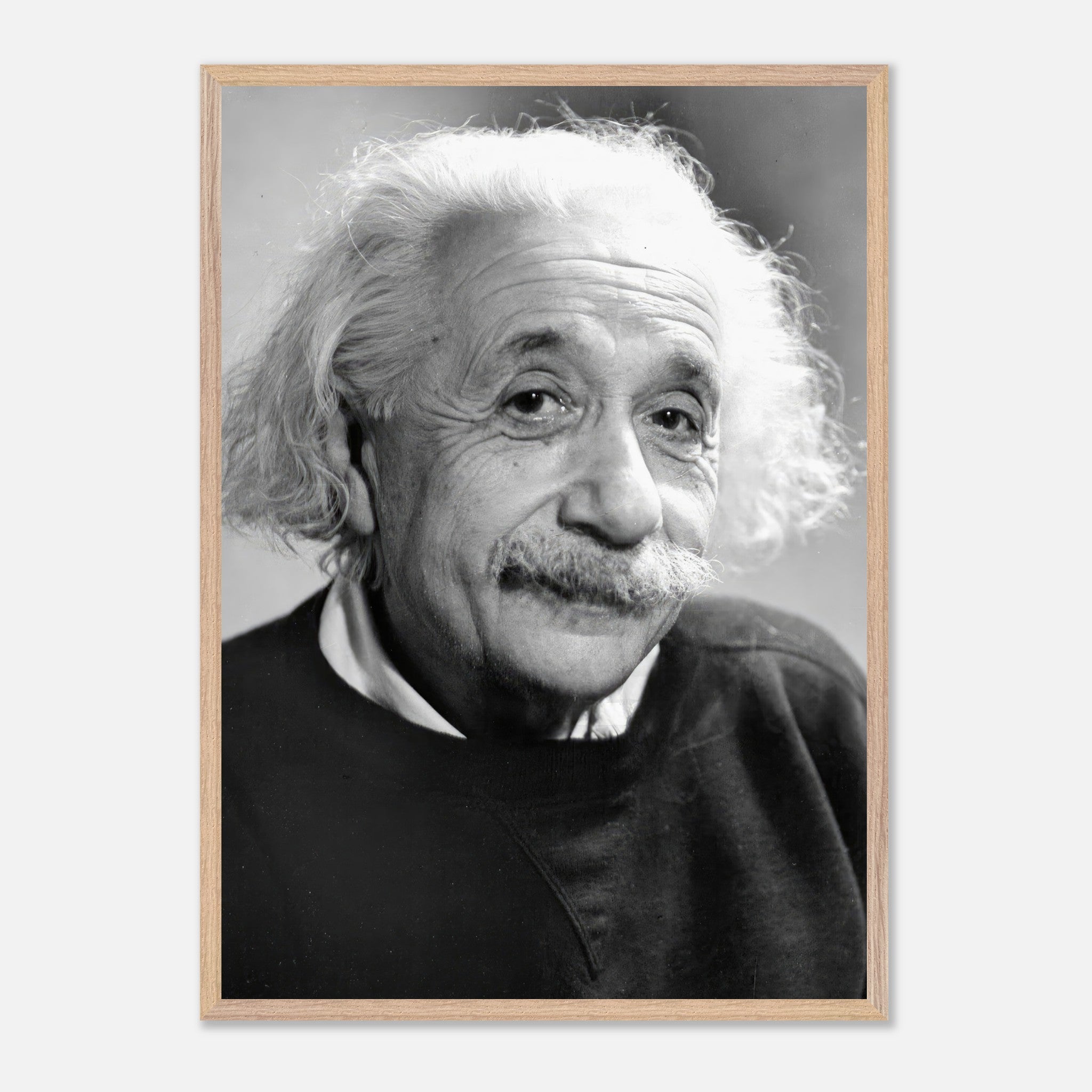 Black-and-white portrait of Albert Einstein from 1946, showcasing his expressive eyes and iconic hairstyle.