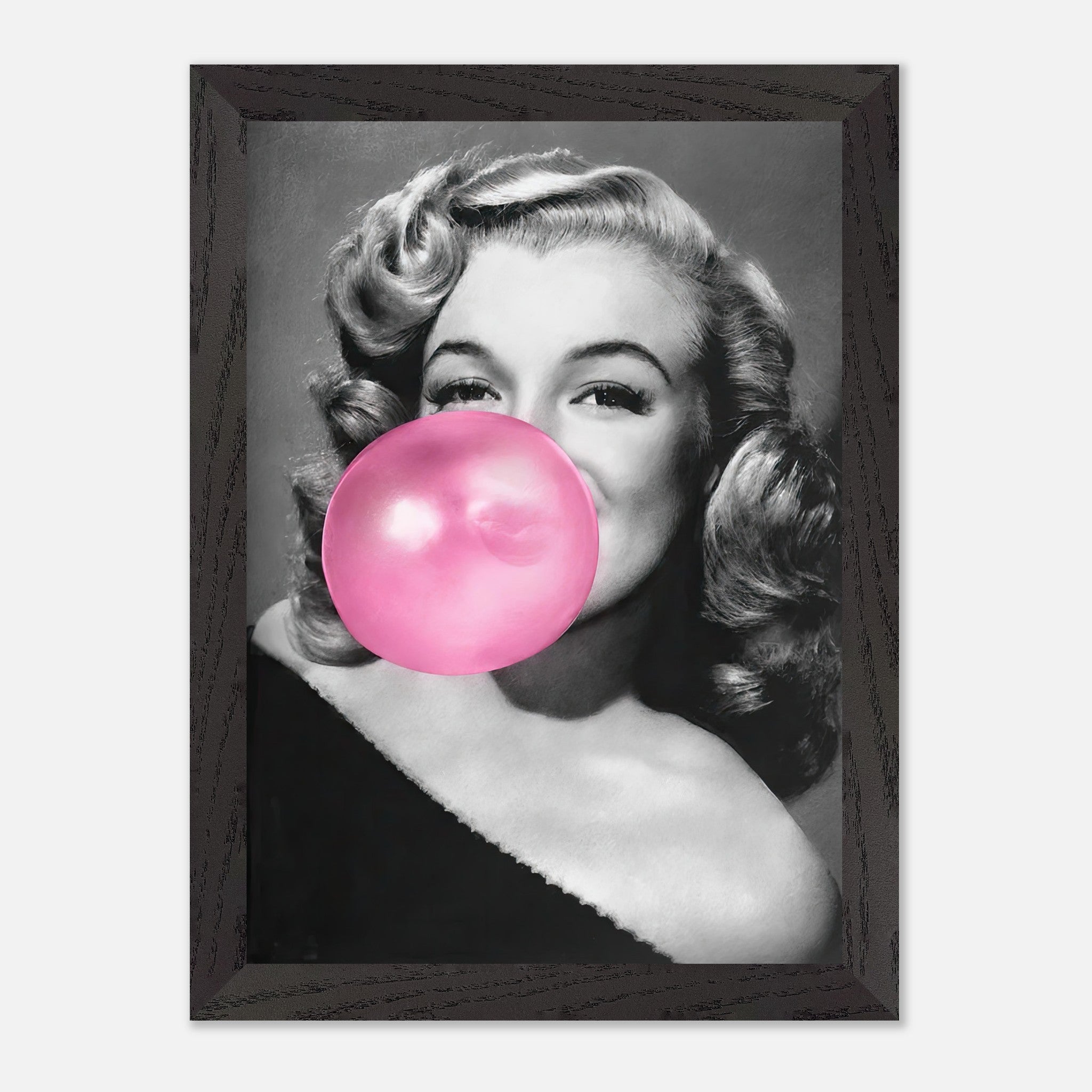 Vintage framed print of Marilyn Monroe blowing a pink bubble gum, adding personality to any wall decor.