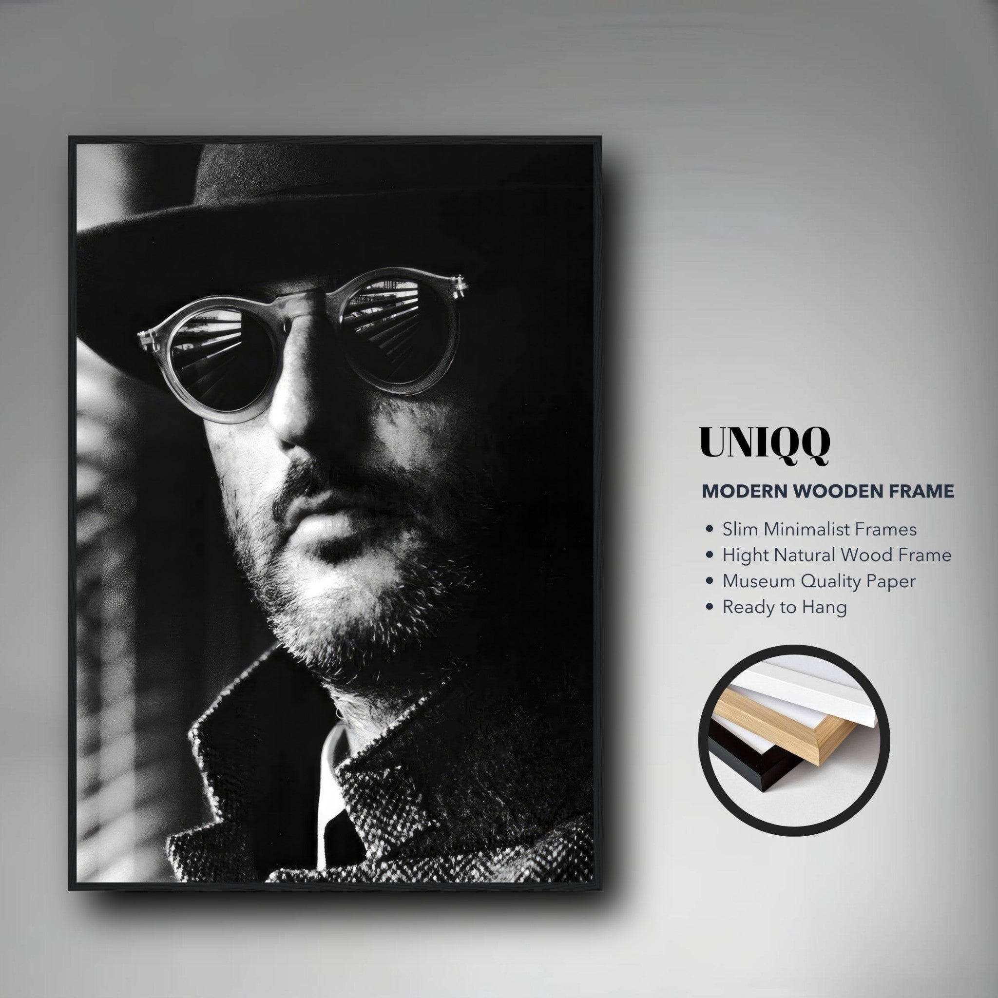 Jean Reno Leon Photography Framed Print in a modern wooden frame, showcasing sophisticated black-and-white cinematic art.