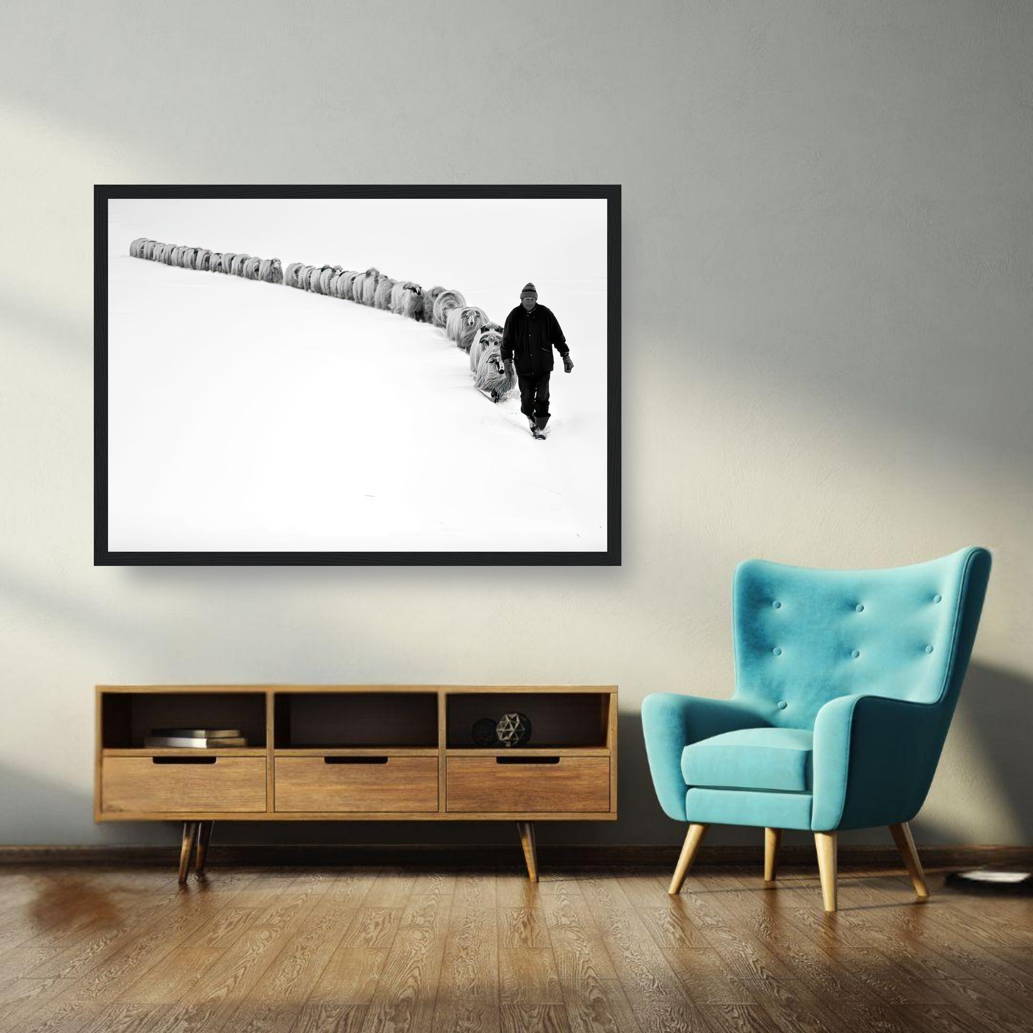 Framed print of a shepherd guiding a flock in a snow-covered landscape, symbolizing resilience and unity.