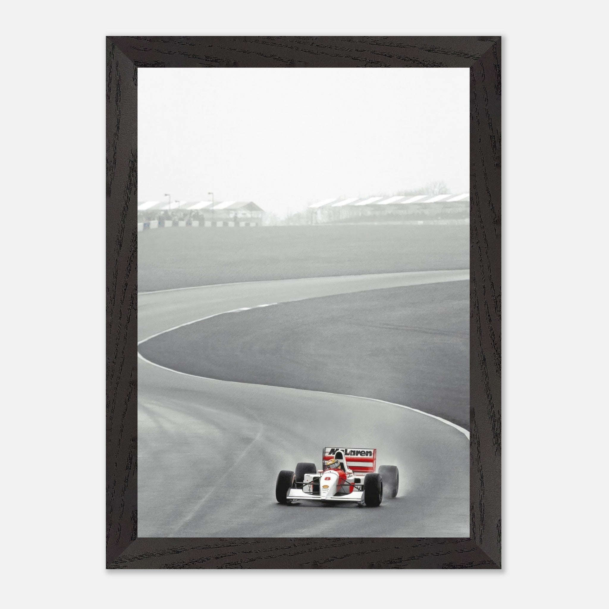 1988 vintage framed art of Ayrton Senna driving the McLaren MP4/4 on a racetrack in black and white.