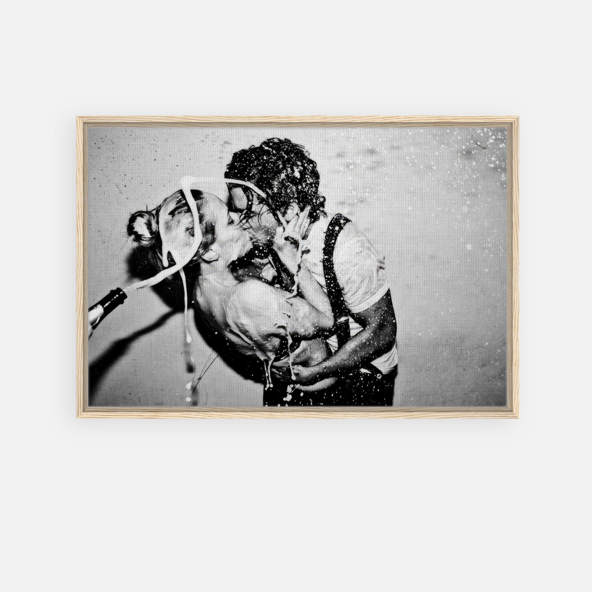 Framed canvas print of Johnny Depp and Kate Moss kissing in a spray of champagne, capturing Hollywood's iconic couple.