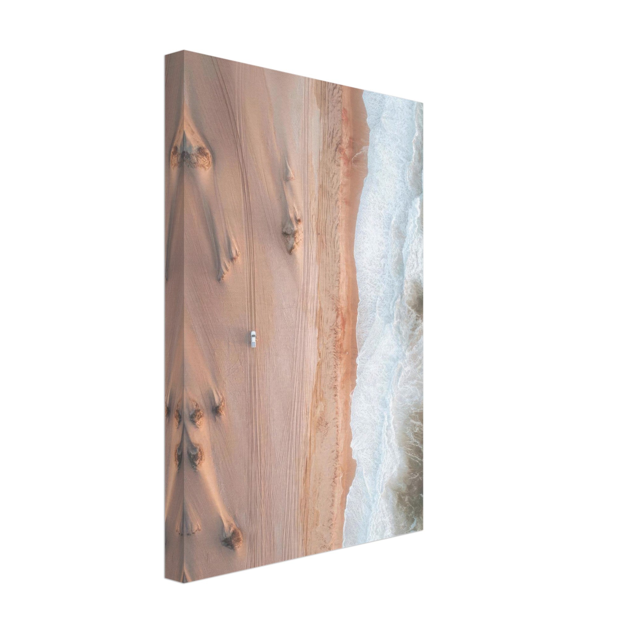 Aerial view of desert sand dunes meeting ocean waves in a stunning drone photography canvas print.