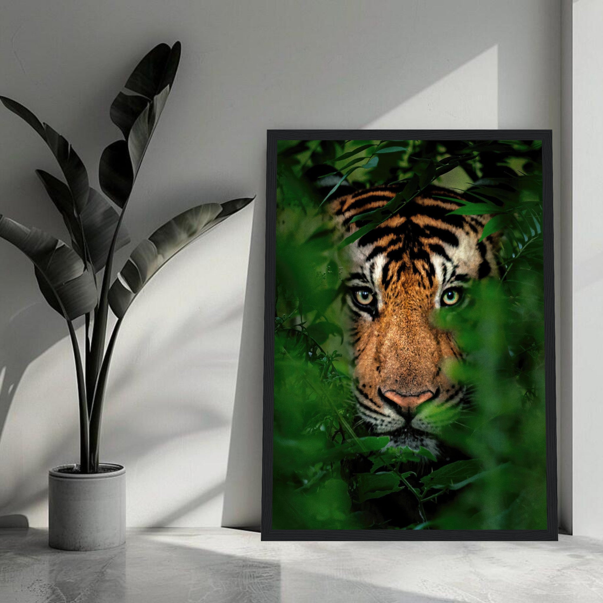 Tiger Through Jungle framed print showcasing a fierce tiger peering through lush green foliage.