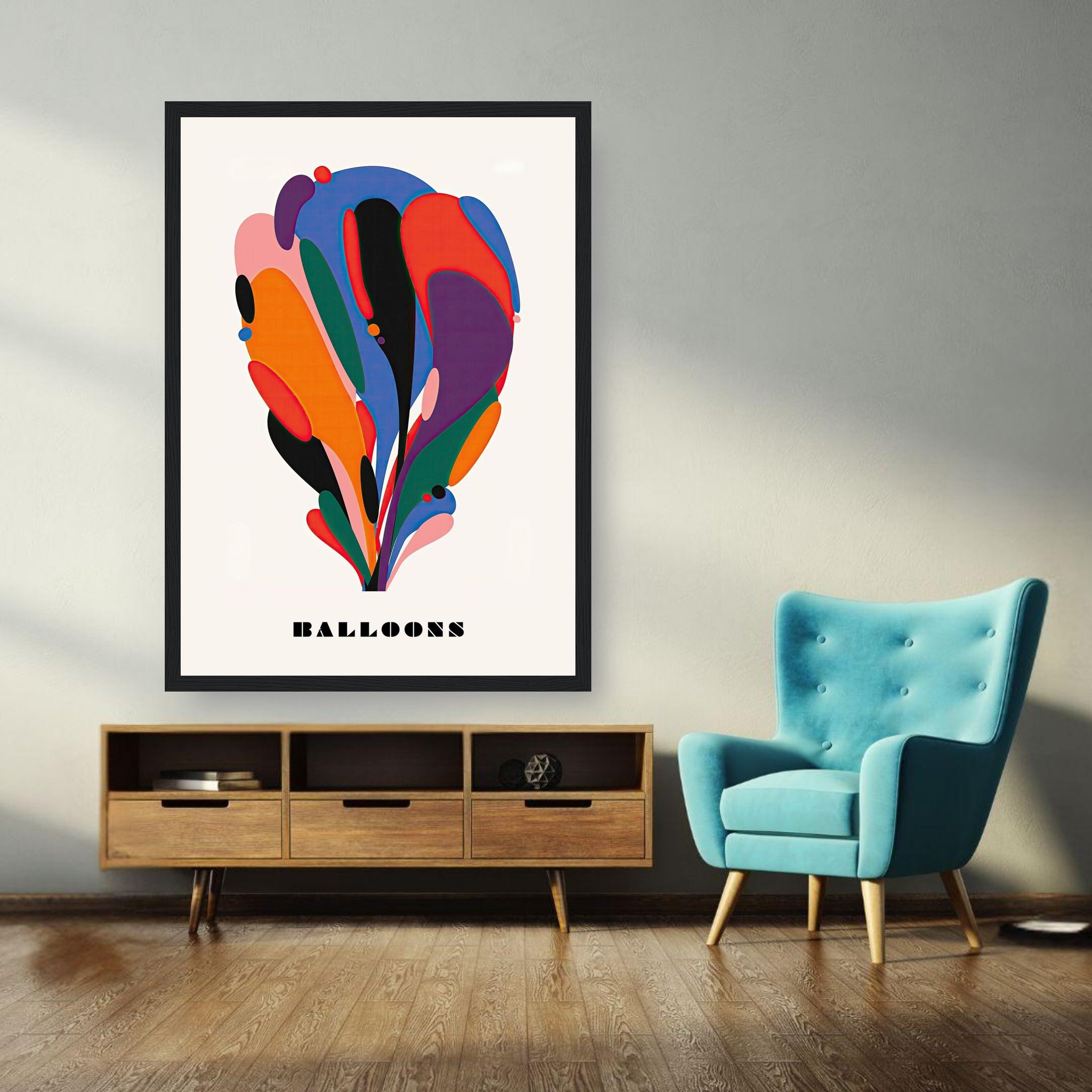 Framed Abstract Balloon Art print featuring vibrant colors in a modern living room with teal chair.