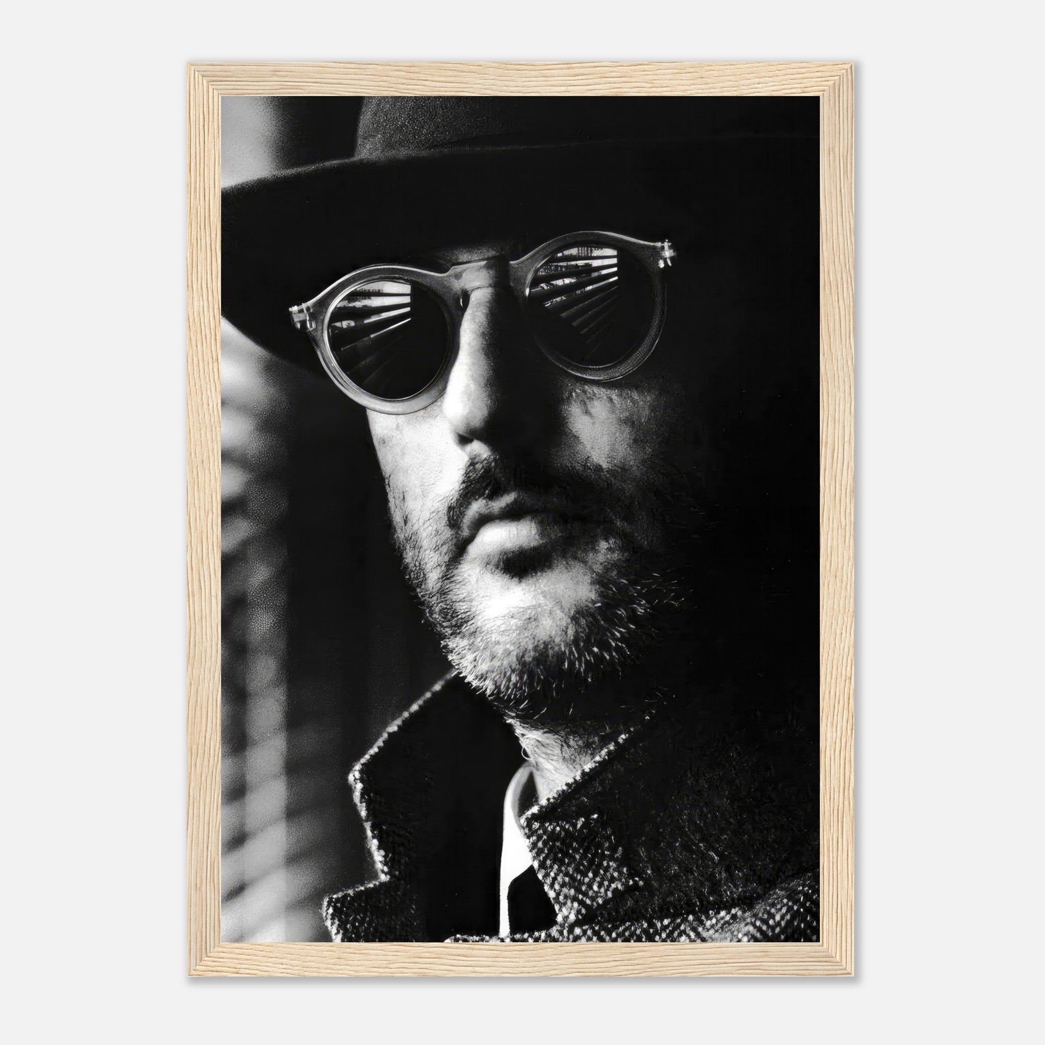 Jean Reno Leon Photography framed print featuring a mysterious man in sunglasses and a hat, capturing cinematic elegance.