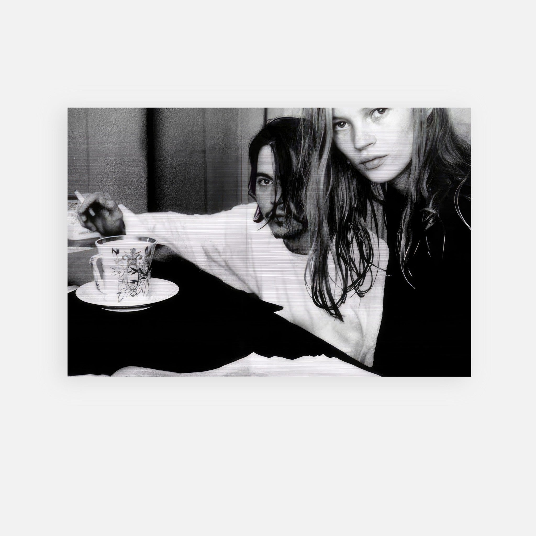 Johnny Depp and Kate Moss in a black and white brushed metal print, capturing 90s rebel romance.