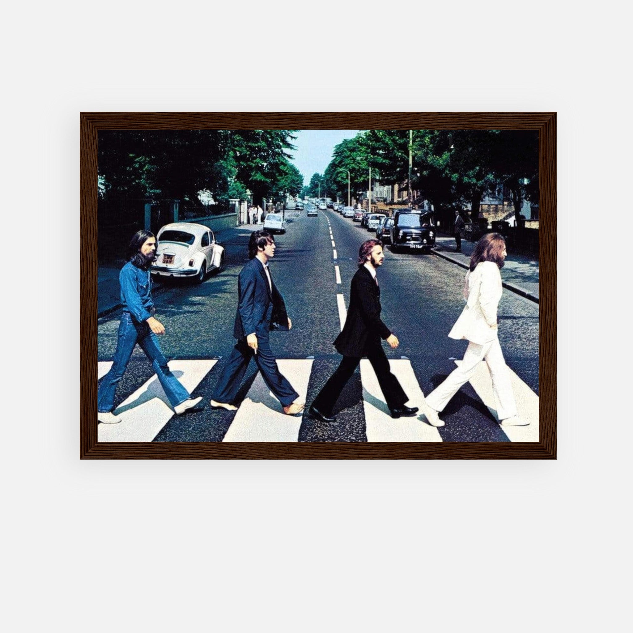 The Beatles Abbey Road framed print featuring iconic band members crossing zebra path in London.