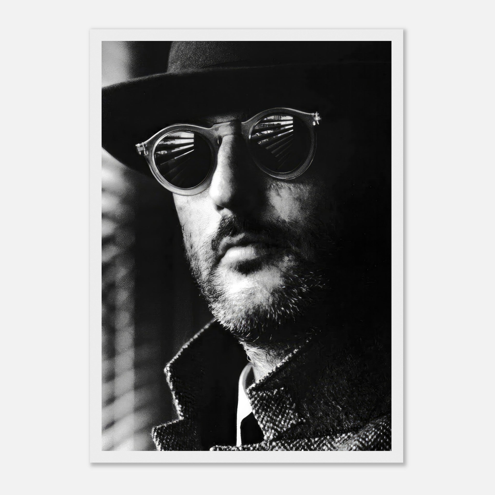 Black-and-white framed print of Jean Reno in sunglasses, exuding sophistication and mystery.