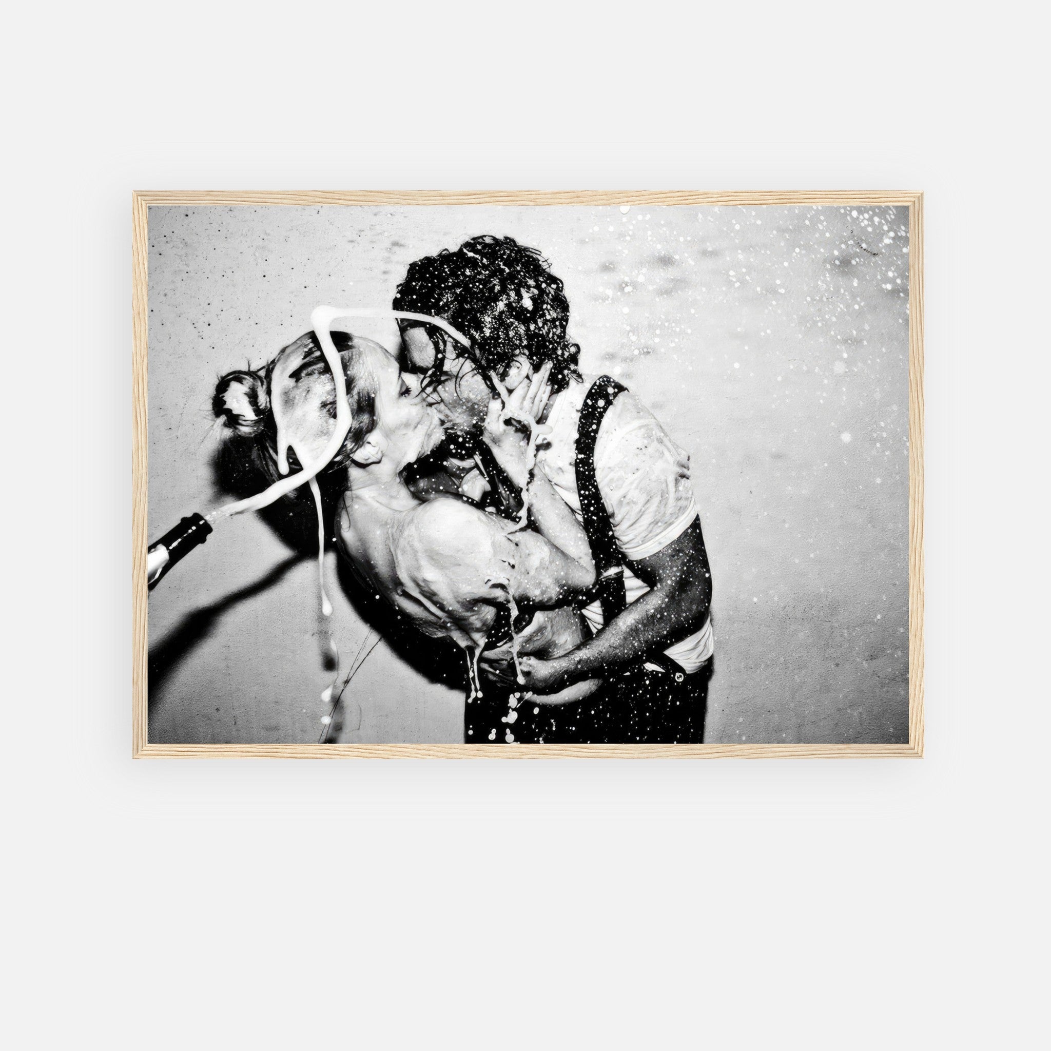 The Champagne Kiss framed print of Johnny Depp and Kate Moss in a passionate black-and-white moment.