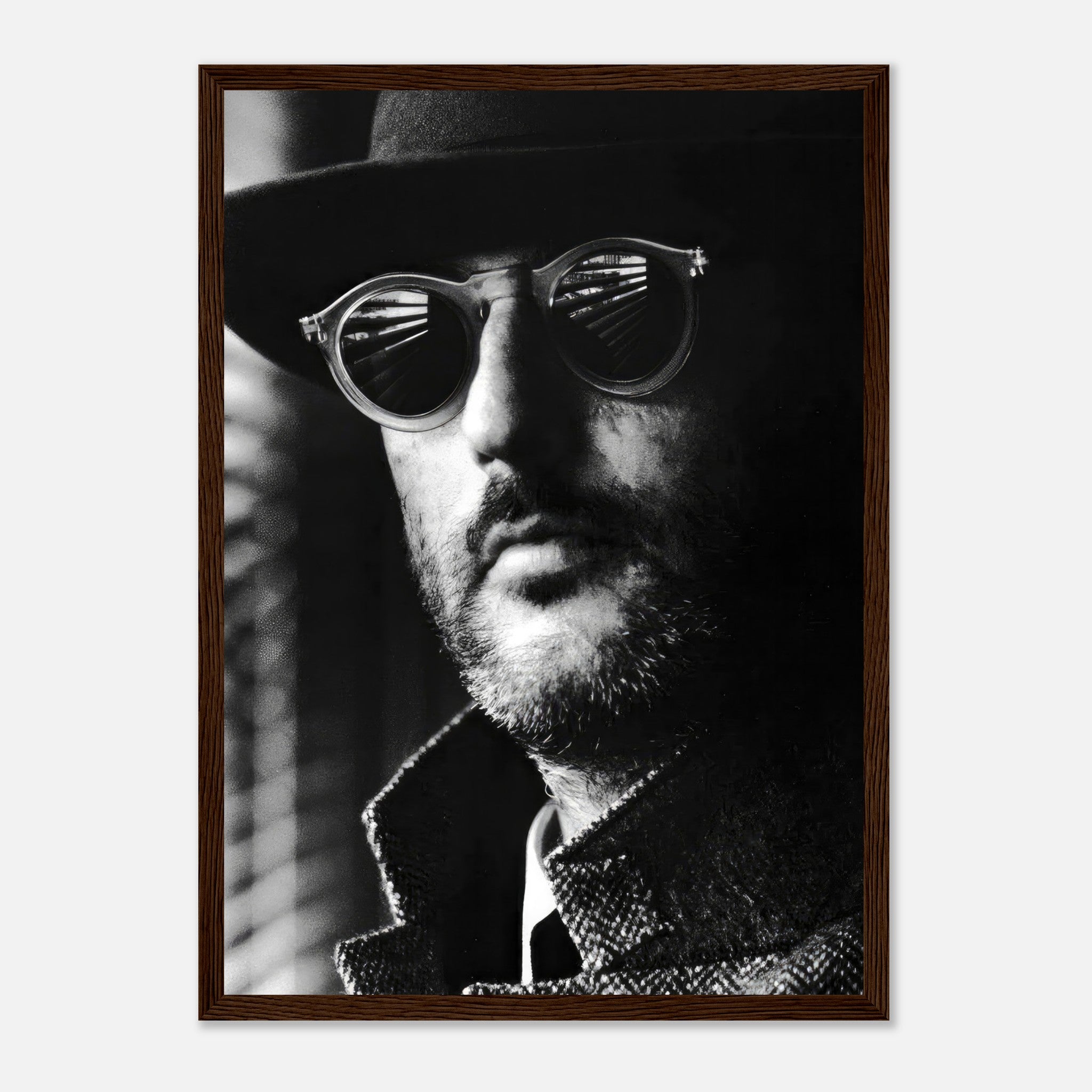 Jean Reno Leon Photography Framed Print featuring a mysterious man in sunglasses and a hat, capturing timeless elegance.