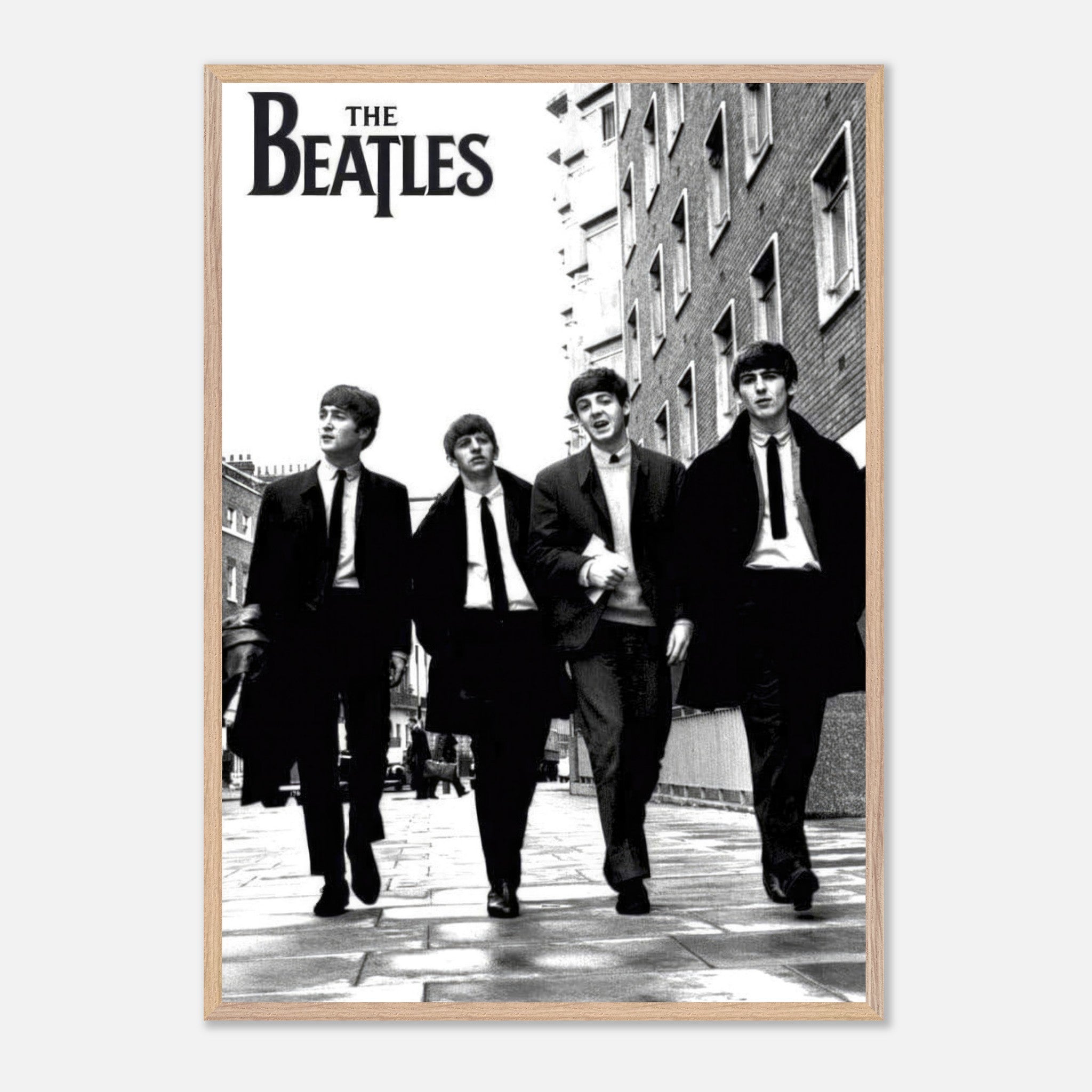 The Beatles Vintage Framed Print showcasing the iconic band walking in suits, perfect for music lovers.